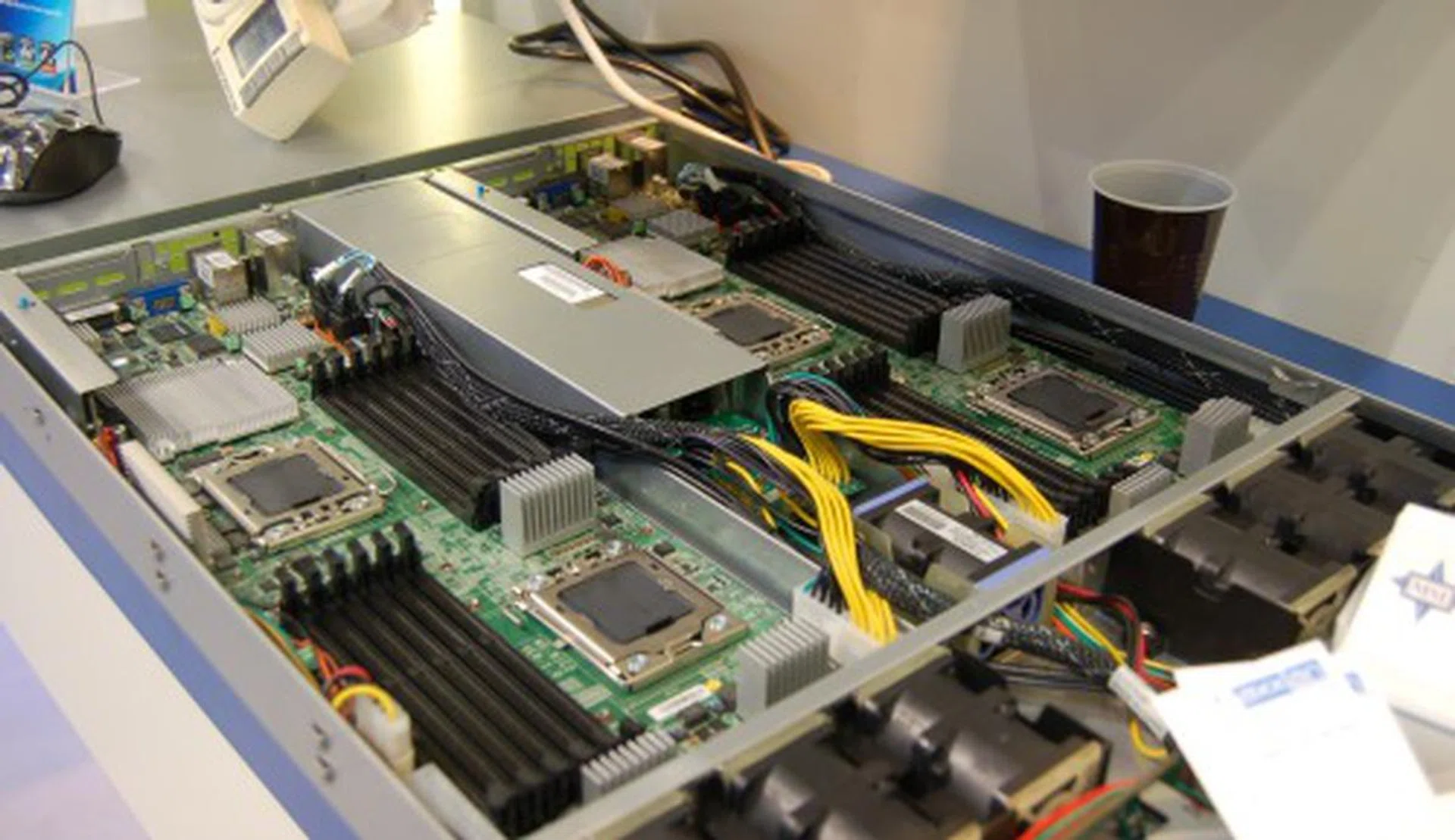  To get up to four of the Nehalem-class Xeon 5500 series processors up and running, MSI has this barebones 28-inch 1U rackmount server, the X2-111-A8M. Take note that this isn't a native quad-socket board, but two Intel 5500 chipset based boards. Now that's an interesting solution while Intel is still validating quad-socket Xeon 7000 series Nehalem class processors. With 24 DDR3 DIMM slots on this server, it supports both registered an unregistered memory for a total of 196GB. It also supports up to eight SATA II 2.5-inch HDD (four per board), dual PEG riser slots, quad Gigabit LAN ports, eight USB 2.0 ports, two Infiniband ports and a 1KW PSU to support it all.  