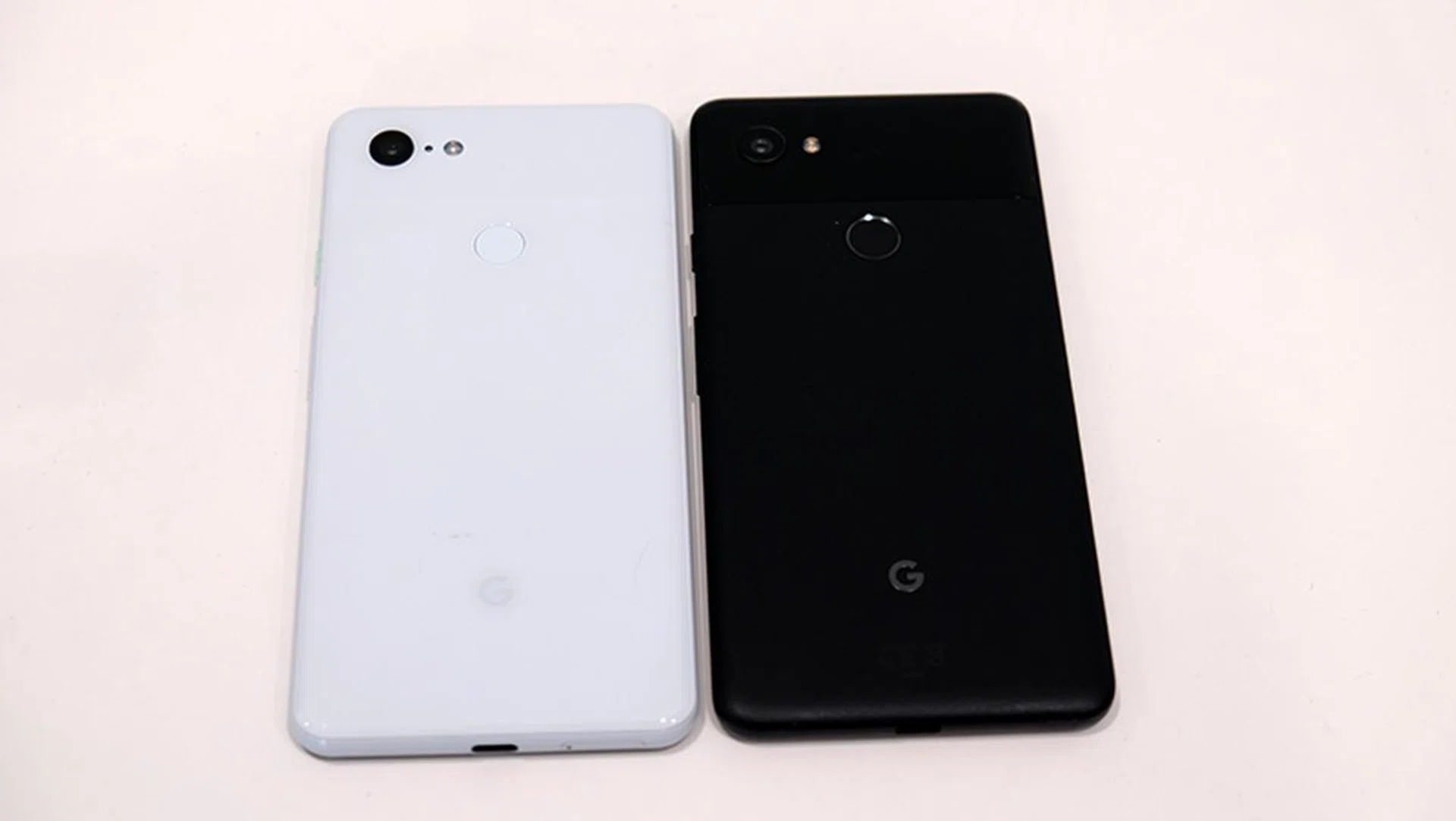The Pixel 3 XL (white) beside the Pixel 2 XL (black). 