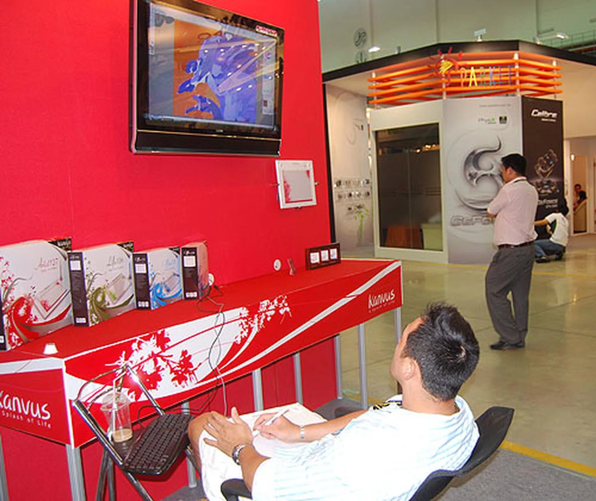 Applying the finishing touches to his art using a Kanvus tablet.