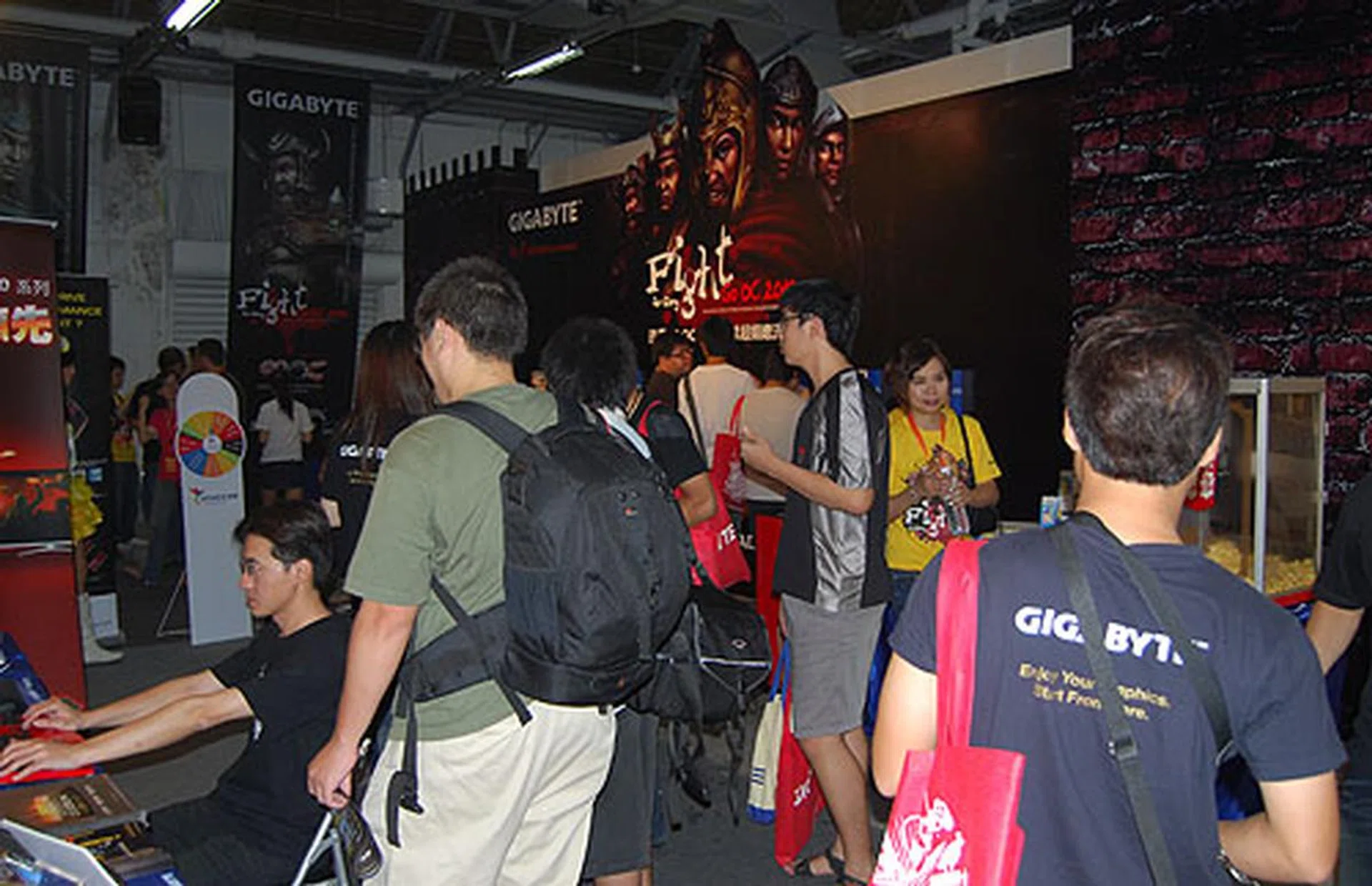 Visitors mingling at the sponsors' booth.