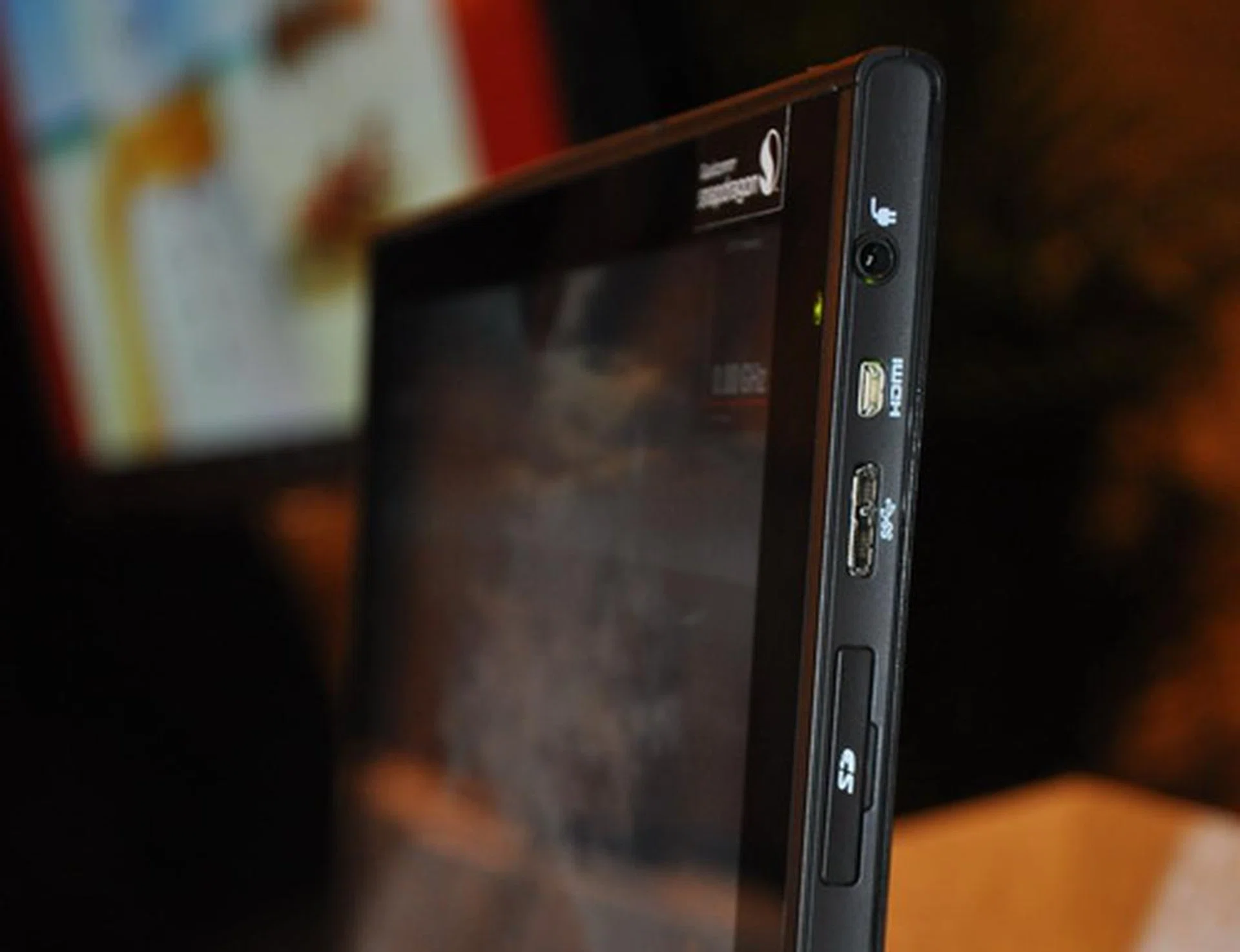 Seen here is the prototype tablet's profile which is noticeably thicker than that of a commercially available tablet. It hosts an HDMI, USB 3.0, and an SD card slot.