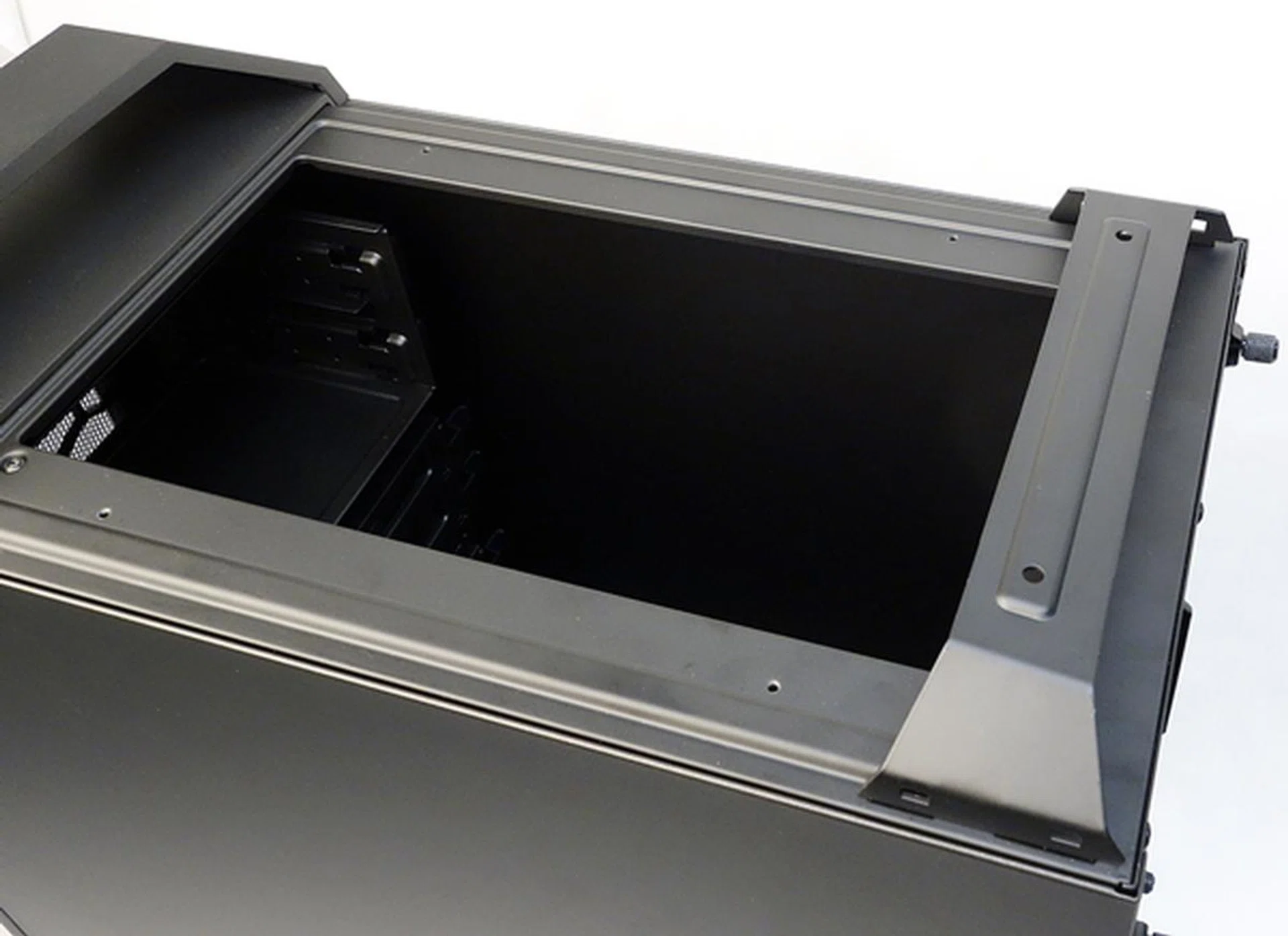We removed the original top mesh cover, as well as the plastic rear handle cover.