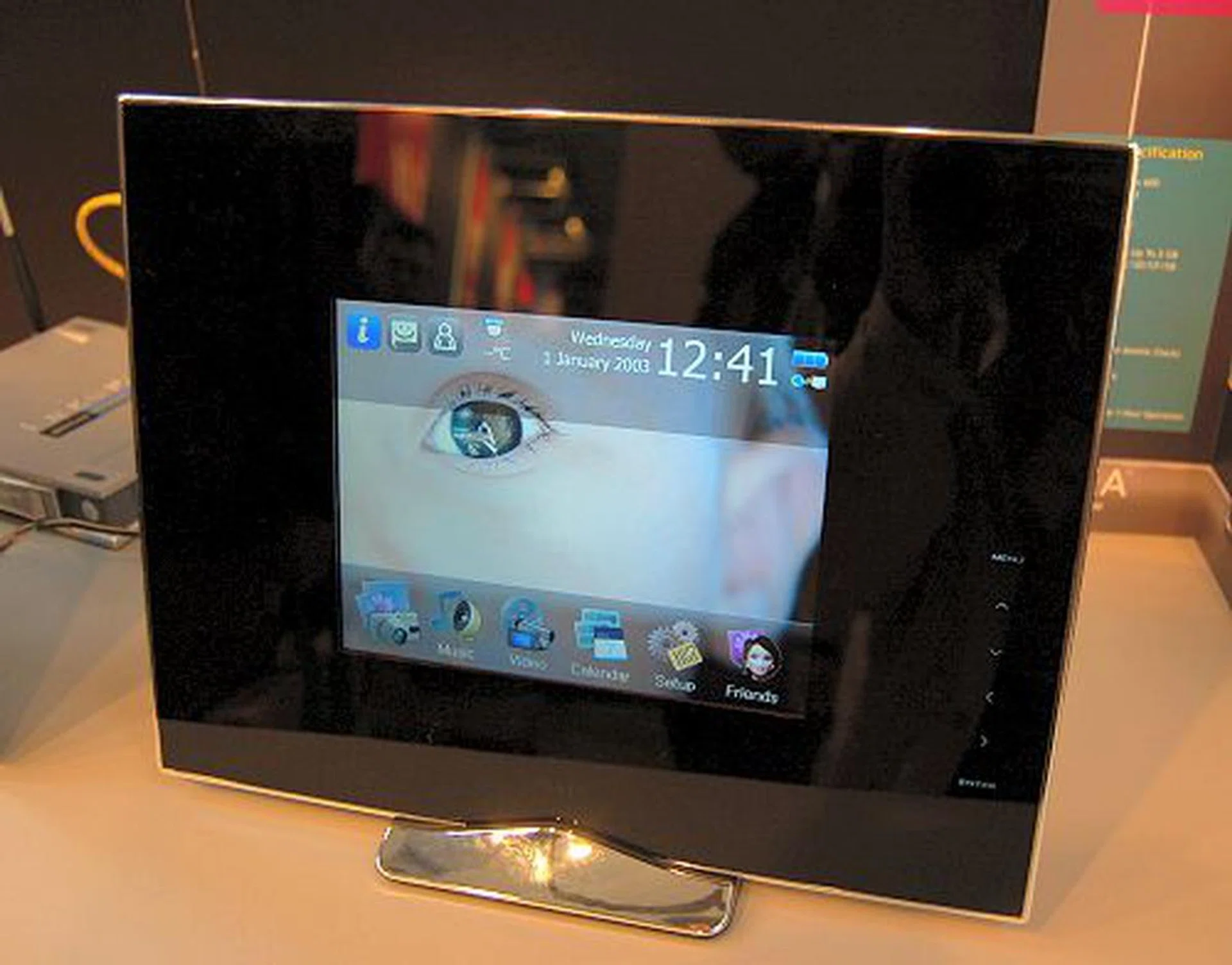  Enter the Wireless Pixxa digital photo frame. Unlike most traditional digital photo frames that play a slideshow and background music, this device does a whole lot more. Highlights include Live New, Photo Messenger, Live Calendar, in addition to the usual photo, video and audio playback support. It can offer such a broad range of services because its custom GUI and operating platform relies on the Internet. Just plug this device to your home network and enjoy the Internet collaboration functions it supports. Specs: an 800x600 resolution 4:3 screen, built-in speakers, on-board memory of up to 2GB, supports MS/MMC/SD/CF/XD memory cards, USB host and slave ports, Wi-Fi 802.11b/g support, real-time clock (syncs with the Internet) and a remote control. Expected SRP is about US$350, but it could be worth it.  