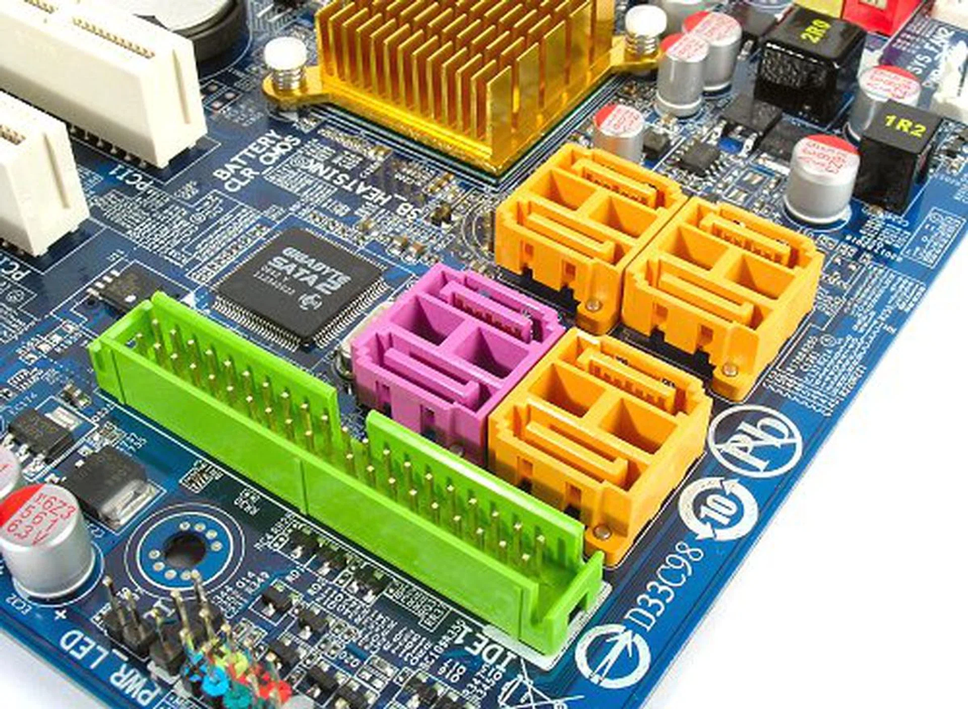 Orange SATA ports are serviced by the ICH9R chipset while the remaining two purple ports are powered by the secondary Gigabyte SATA2 controller seen on the left. This controller also provides the Ultra ATA port on the board.