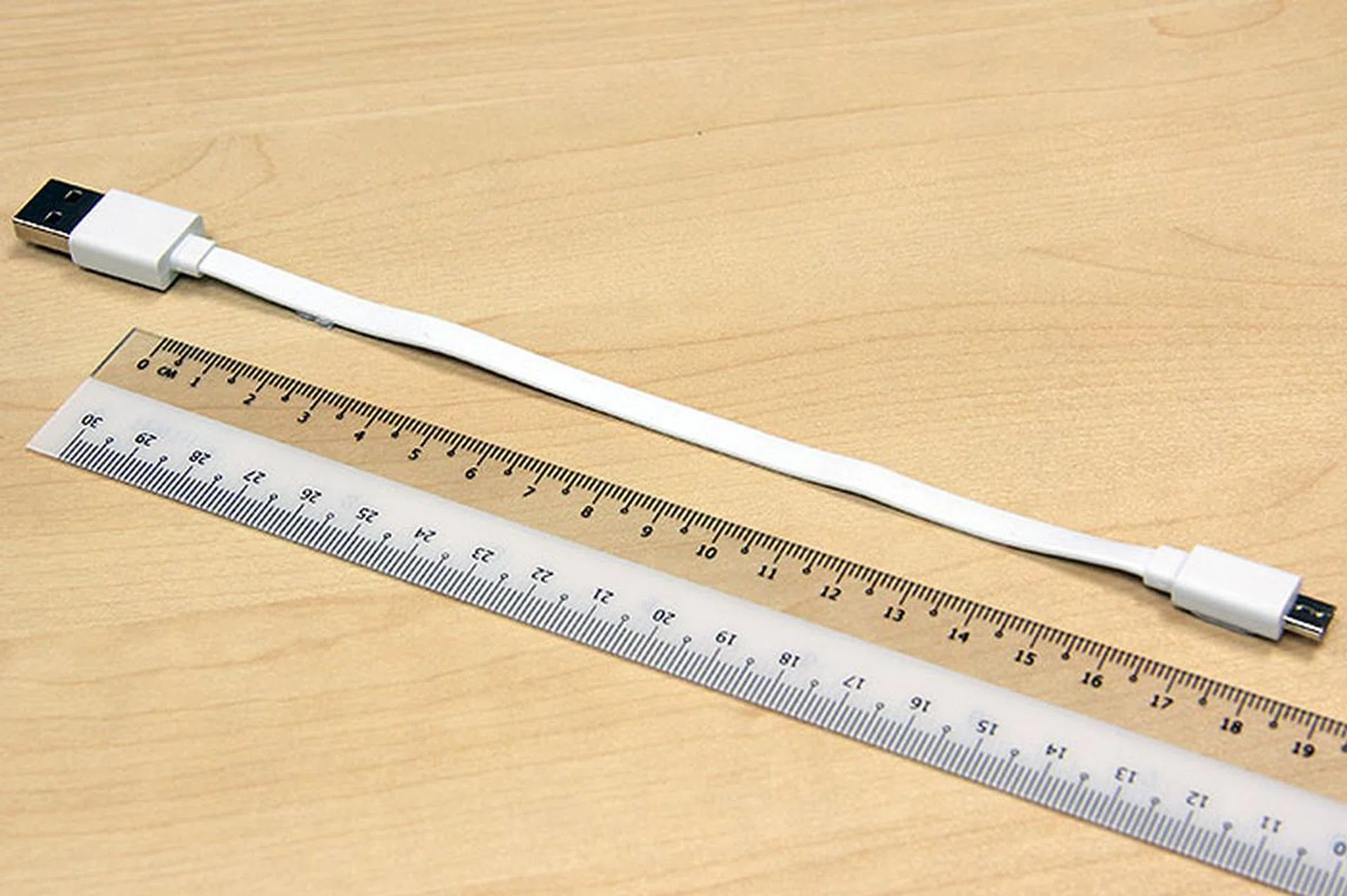 Obligatory shot of the unmarked flat and white USB cable that comes with the Mi Power Bank. (Note: ruler not included.)