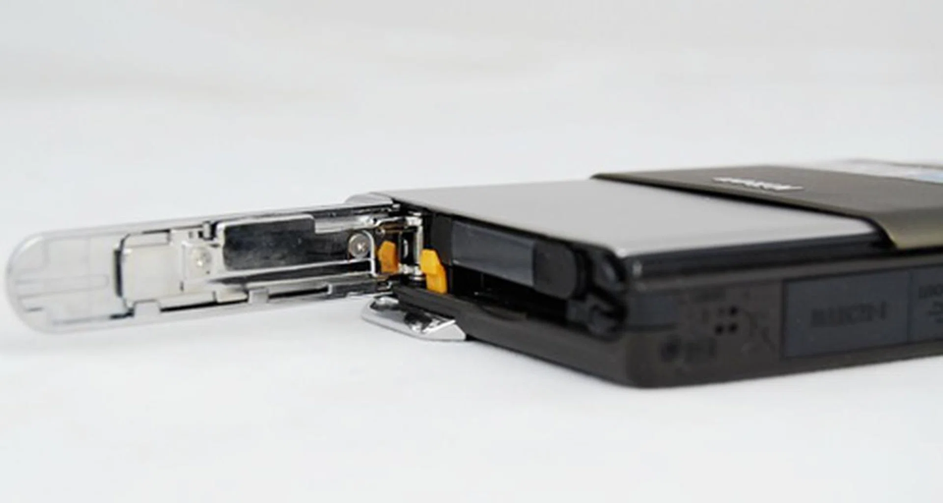 The SD memory card slot is embedded within the battery compartment. It is compatible with SDXC cards.