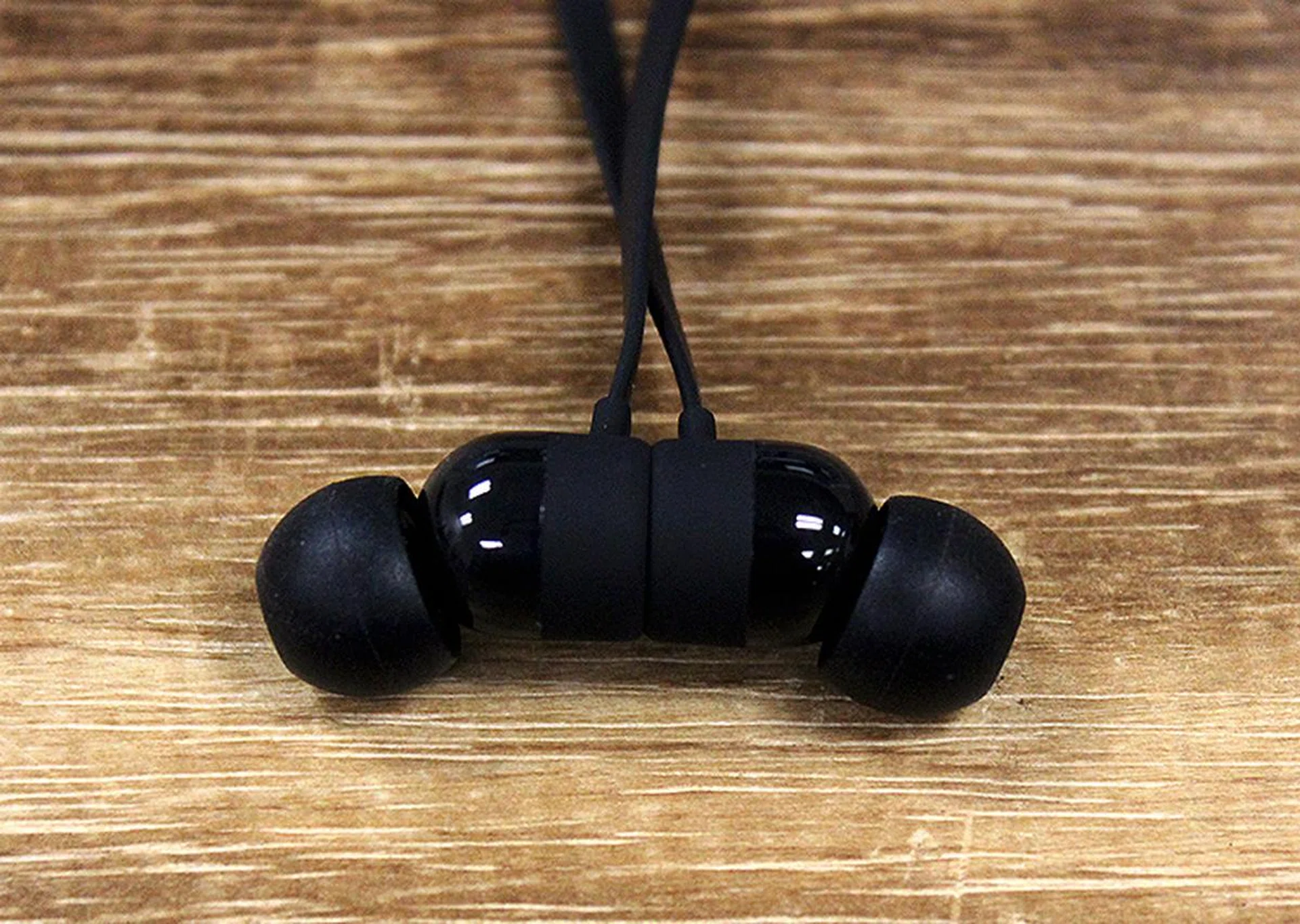 The headphones are magnetic and will automatically attach themselves to each other if you leave them on your neck.