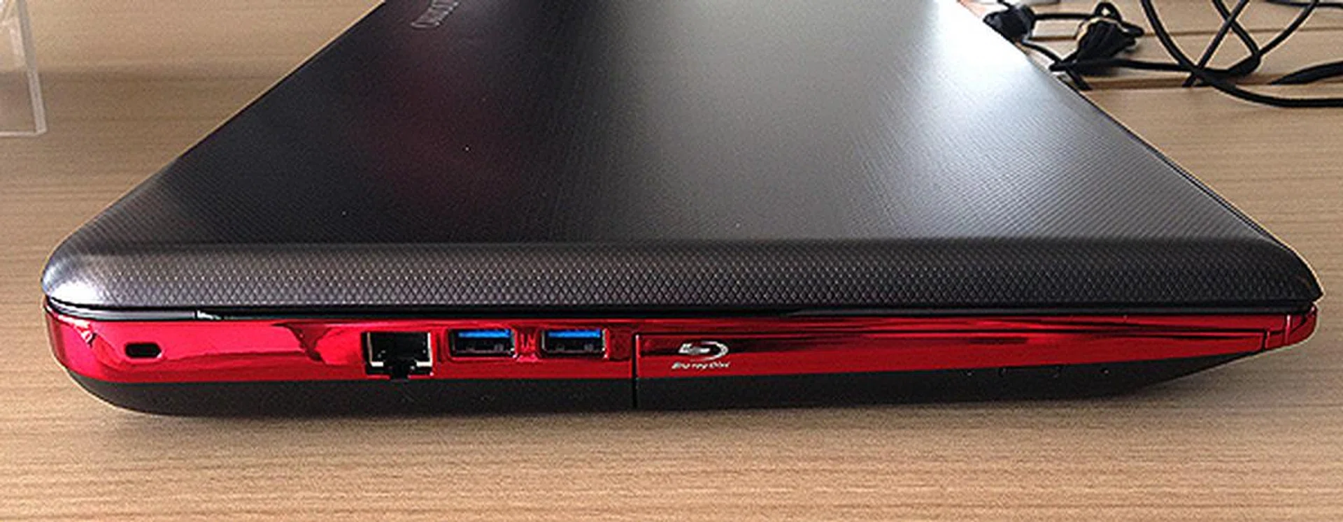 On the left panel, there's an Ethernet jack, two more USB 3.0 ports and a Blu-ray drive.