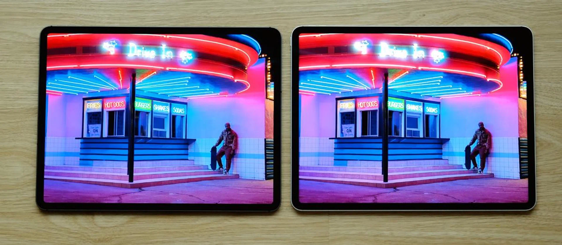 New iPad Pro on the right. The differences are not so obvious in this image but the neon signs "pop" a little more.