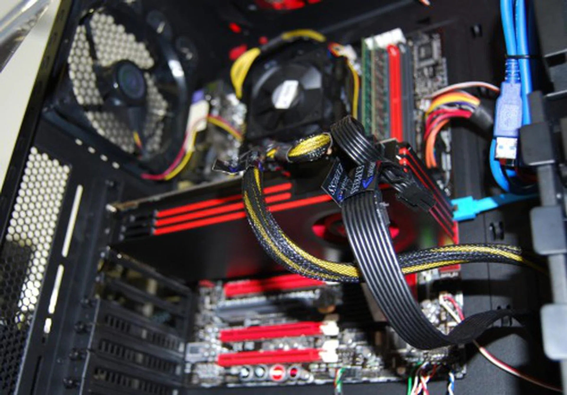 Here's a quick sneak peek look at a Radeon HD 6800 series card used in one of the demo systems at the show. It certainly isn't any larger than the existing Evergreen series; thankfully.