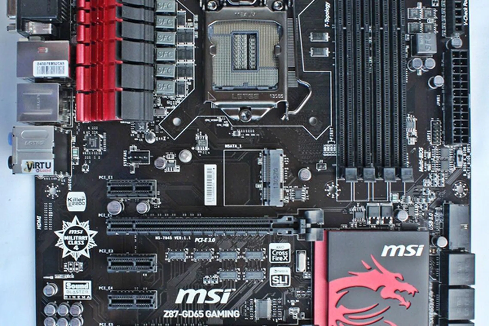 The MSI Z87-GD65 Gaming motherboard sports the same Dragoon Army colors as the earlier MSI Z77A-GD65 board. The main difference is the newer board sports a new LGA1150 CPU socket and the new Intel Z87 chipset.