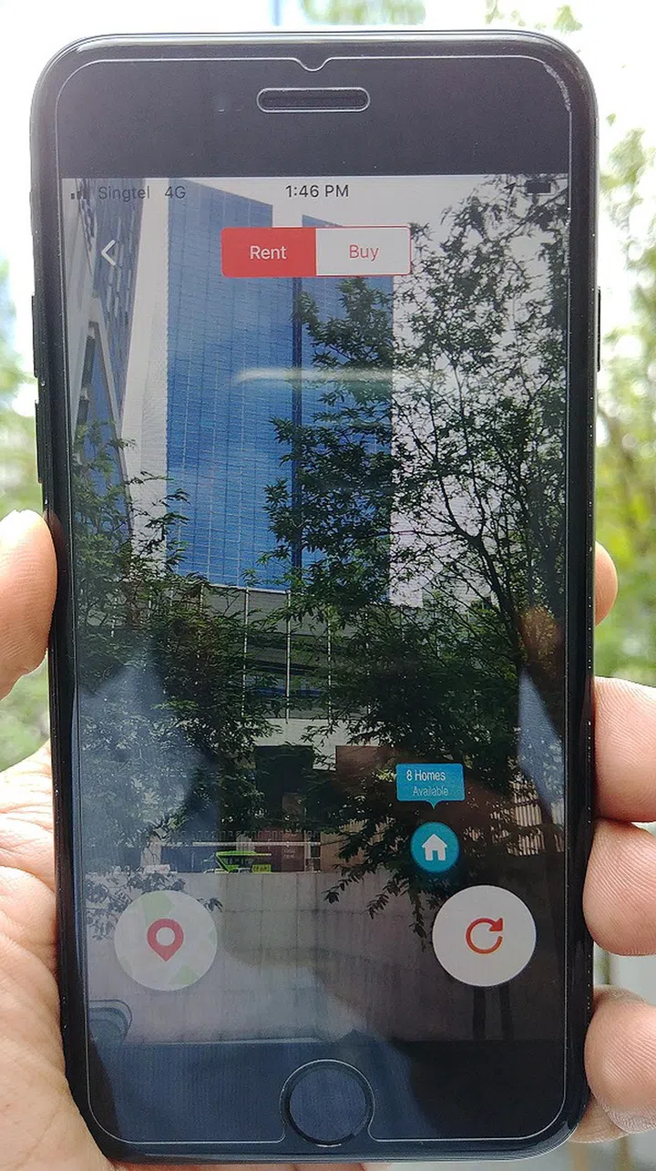 2) Point your camera in the vininity of residential blocks. The app doesn't fetch commercial properties - only residences. Note the blue house icon(s), which represent residential properties. In this case, it reflects in text that PropertyGuru sees 8 residenital listings in the immediate vicinity. All this happens almost instantaneously. Don't forget that the Rent/Buy option is located right on top of the screen to toggle between your necccessary 'lens'.