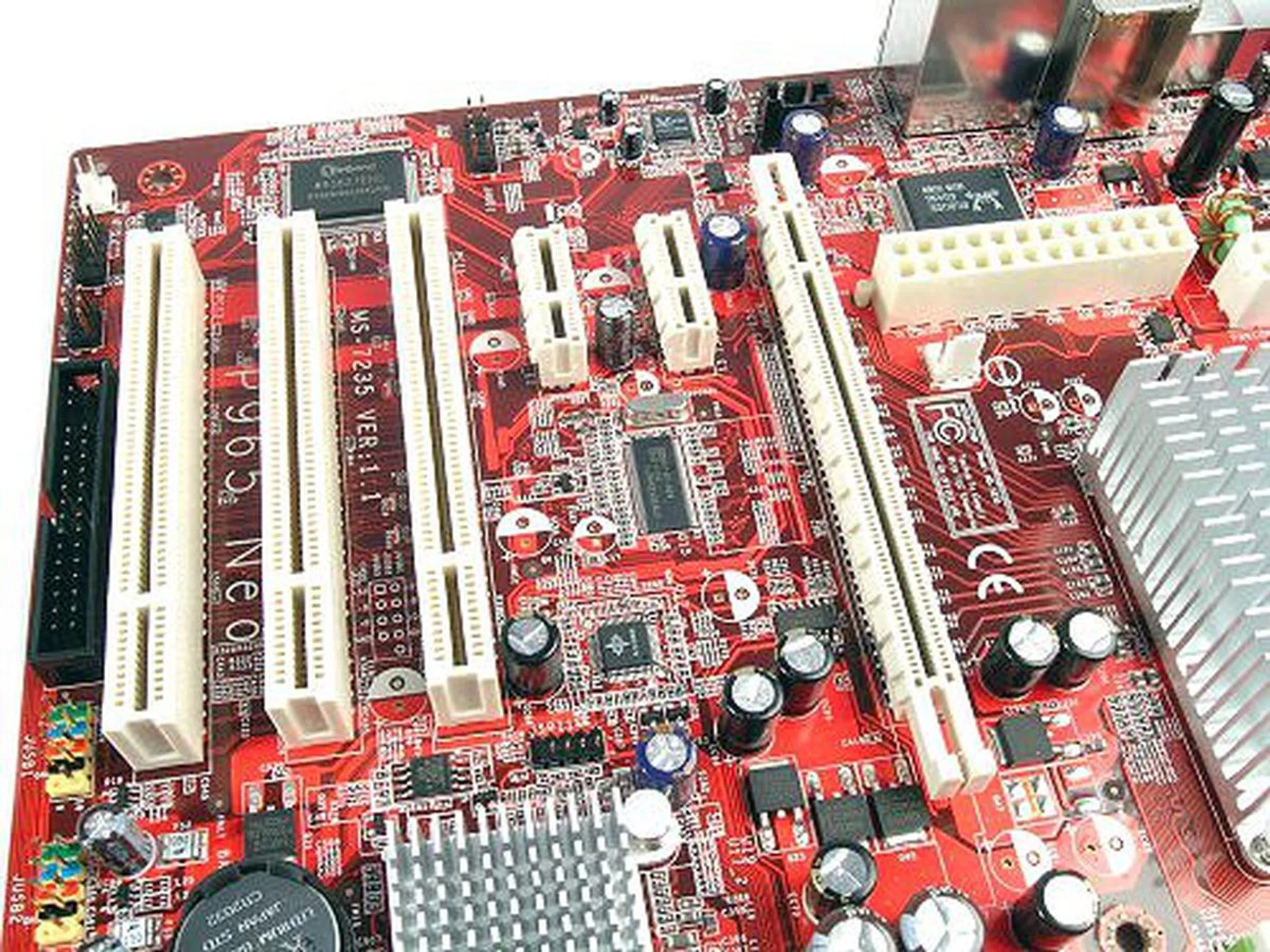 The P965 Neo actually sports a very expandable slot configuration. Even with a huge graphics card, you lose at most one PCie x1 slot. Also notice the wide berth on both sides of the PCIe x16.