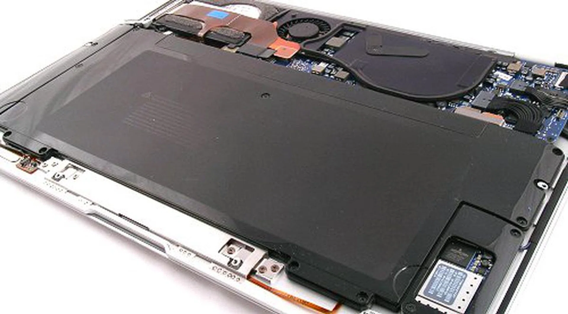 The large black block is the battery. Contrary to popular believe. It is quite easy to remove and replace it yourself. Just remember which screw goes where. Of course, without after market batteries, there's not really much use tinkering inside the MacBook Air.