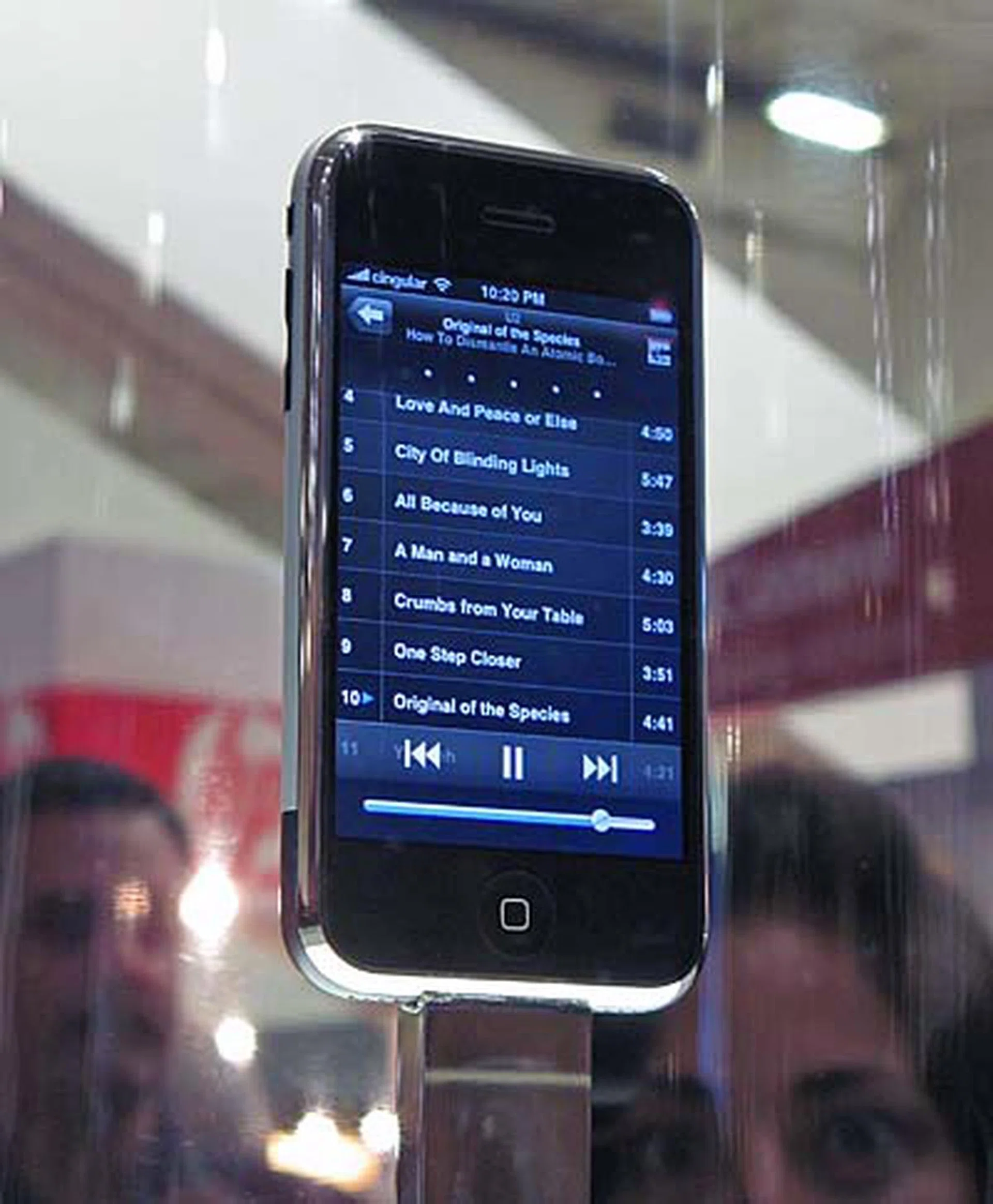 The only iPhone at the exhibit hall is this one that is being perched on a revolving platform, and enclosed by a glass cylinder. There are security people guarding the "exhibit" throughout the day.