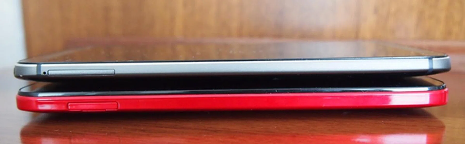 Unlike the HTC One (M8), you do not need to use a pin to eject the nano-SIM and microSD card slots on the HTC Butterfly 2 (pictured at the bottom). You have to ensure that the trays are fully inserted to prevent any water damage.