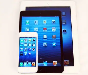 Seen here are the Apple iPhone 5, iPad Mini and the first gen-iPad.