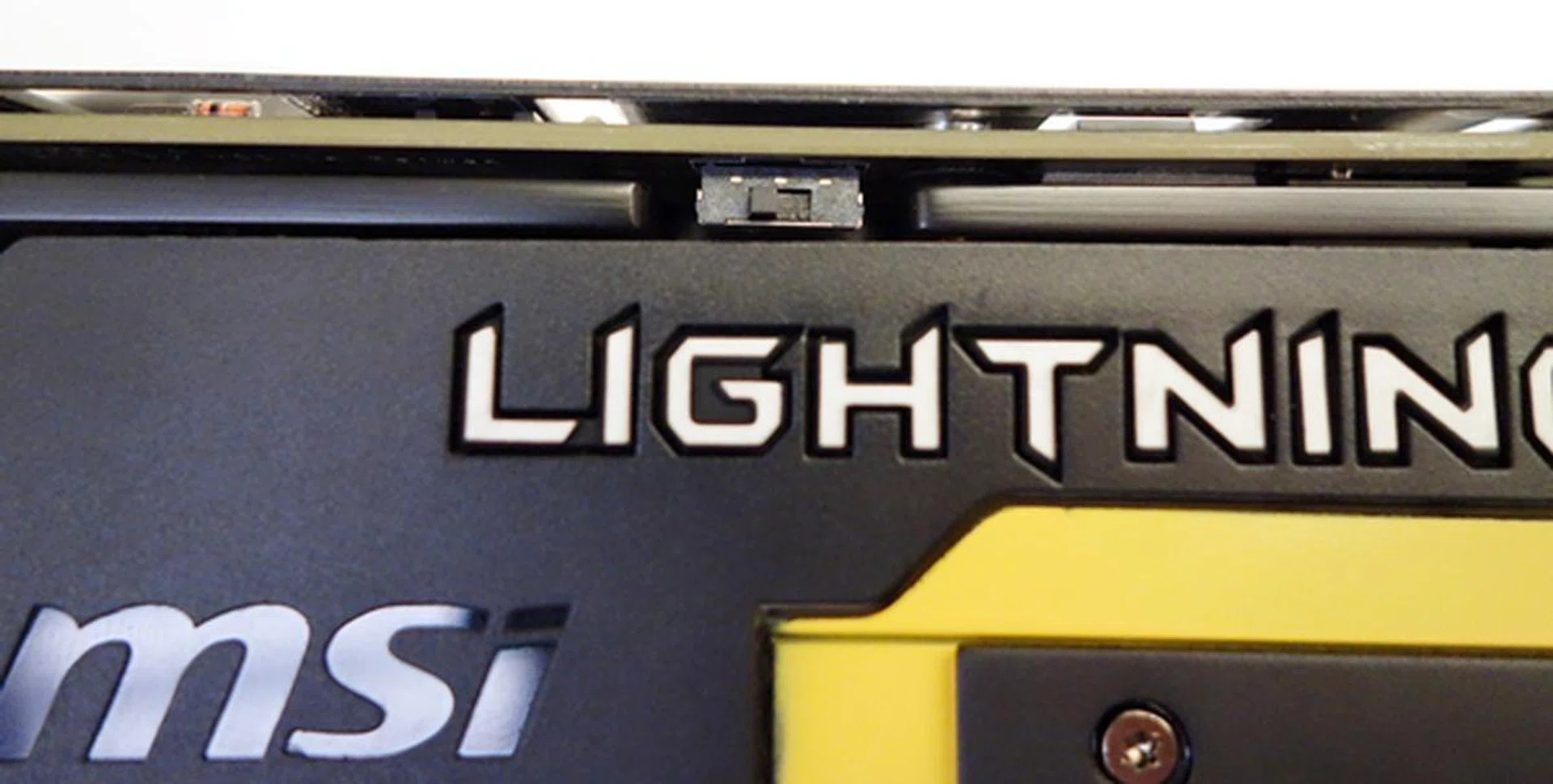 The BIOS switch is pictured at its default position. If the switch is moved to the right, the BIOS loaded will operate the card at the default specifications of a stock GTX 780 card.
