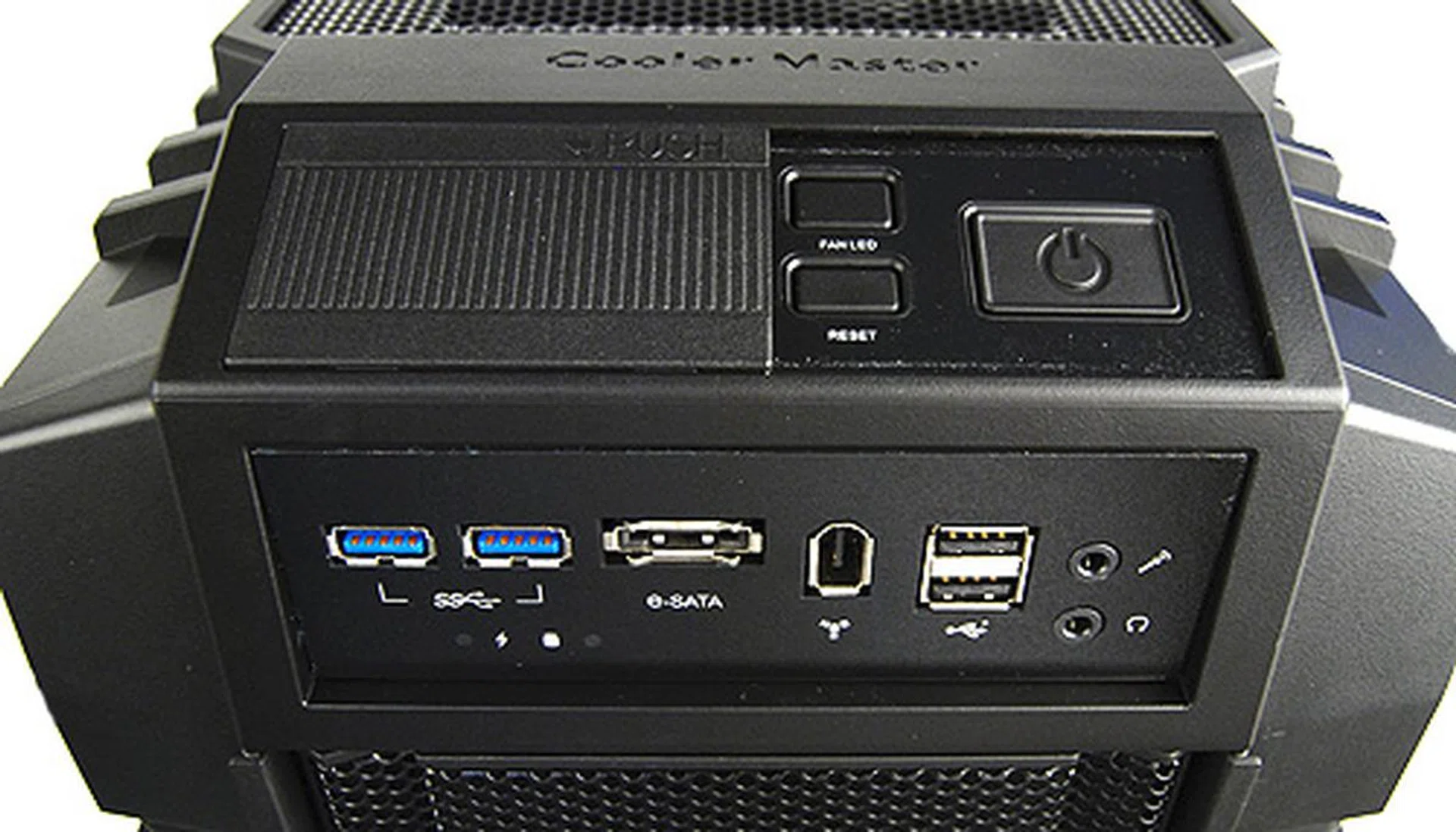 The front IO consists of two USB 3.0 ports, two regular USB 2.0 ports, eSATA, FireWire, headphones and microphone jacks.
Above it is a separate panel that holds the power and reset buttons, as well as a button to turn off the front LED lights. Also, there's a plastic dust cover to prevent the buttons from getting clogged with dust and to prevent accidental system shut downs. Honestly, the USB ports, headphones and microphone jacks could use the dust cover more.