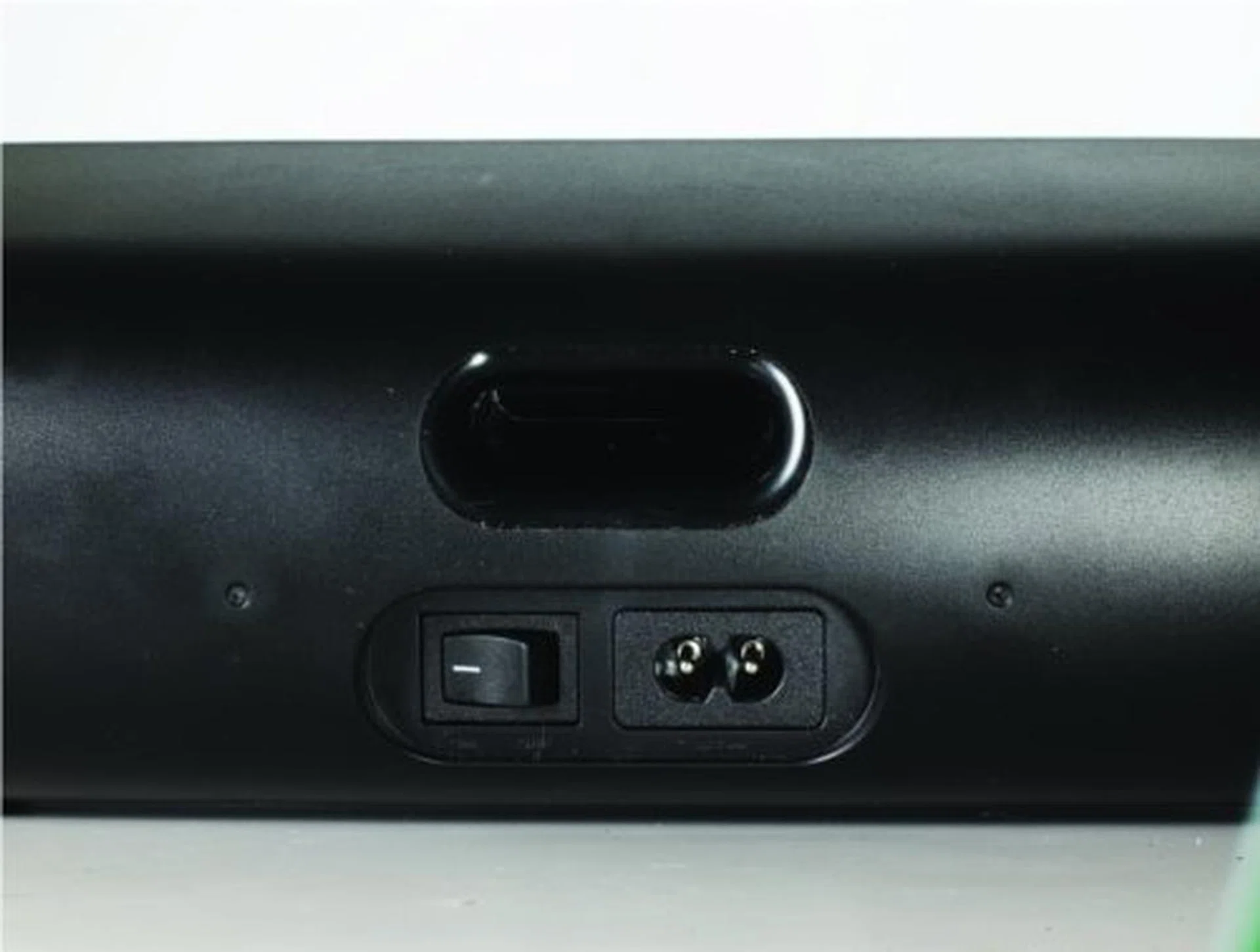 The power switch is located at the back; there's no external power supply to deal with, just plug in the power cord.