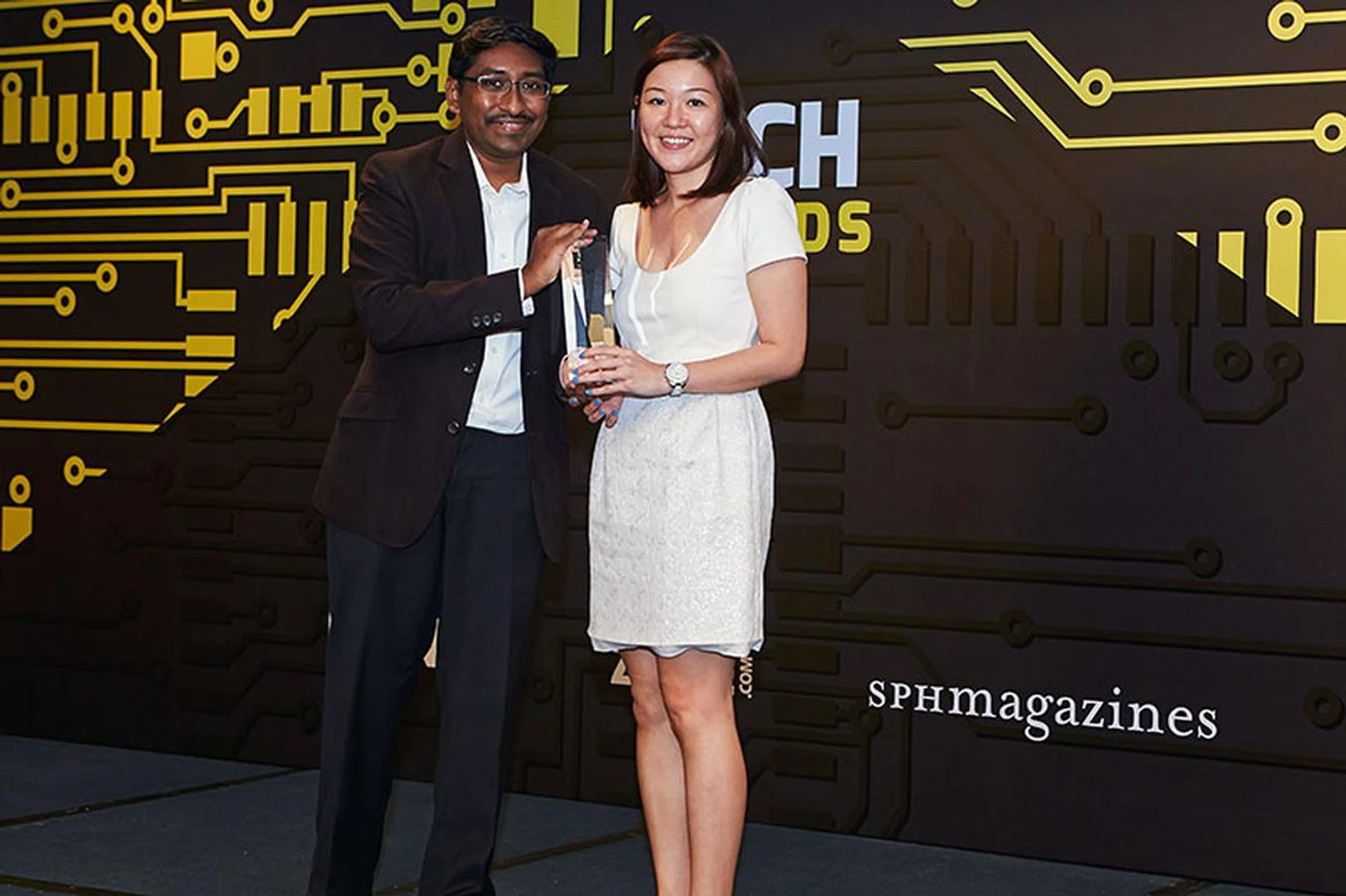 When we asked which is your favorite keyboard and mouse brand, most of you voted for Logitech. Accepting the trophy here is Ms. Shirley Neo, Country Manager for Logitech Singapore.