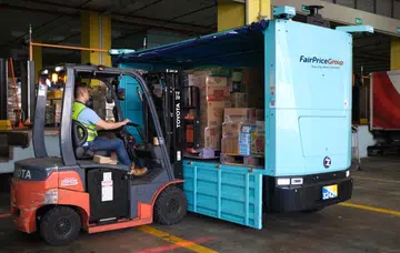 Loading goods onto the Zelos Z10 at Fairprice Group's Benoi distribution centre. Photo: Fairprice Group