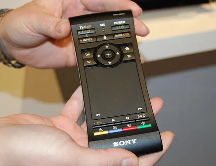 Sony’s new remote seen here supports finger gesture controls on the trackpad, has a 3-axis motion control ...