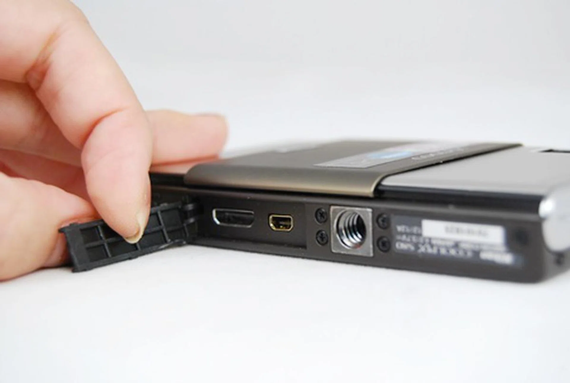 The inconspicuous A/V out and mini HDMI ports are tucked at the bottom and covered by a rubber cap.