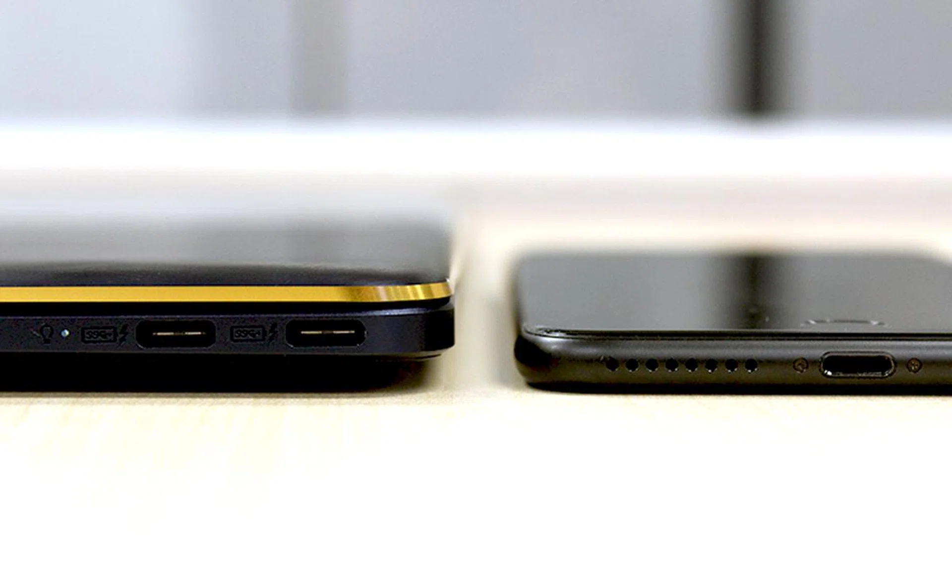 The ZenBook 3 Deluxe is really thin. Here it is next to an iPhone 7s Plus. However, its thin design has led to some compromises on performance and cooling.