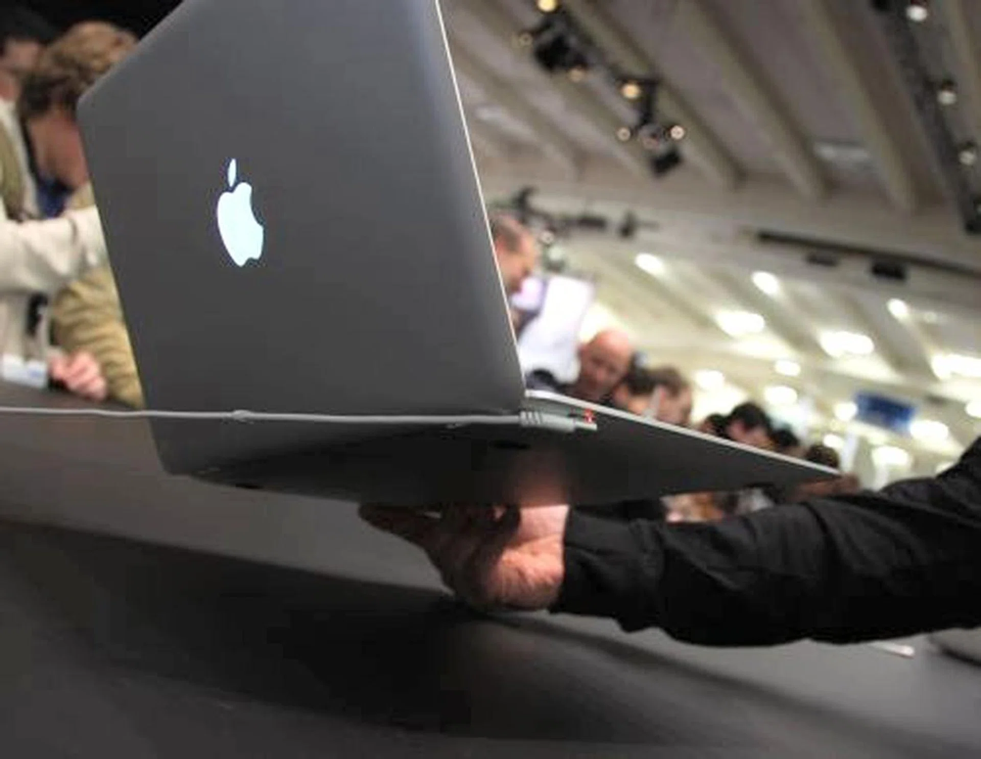 The notebook uses Apple's MagSafe Power Adapter, designed for mobile users.
