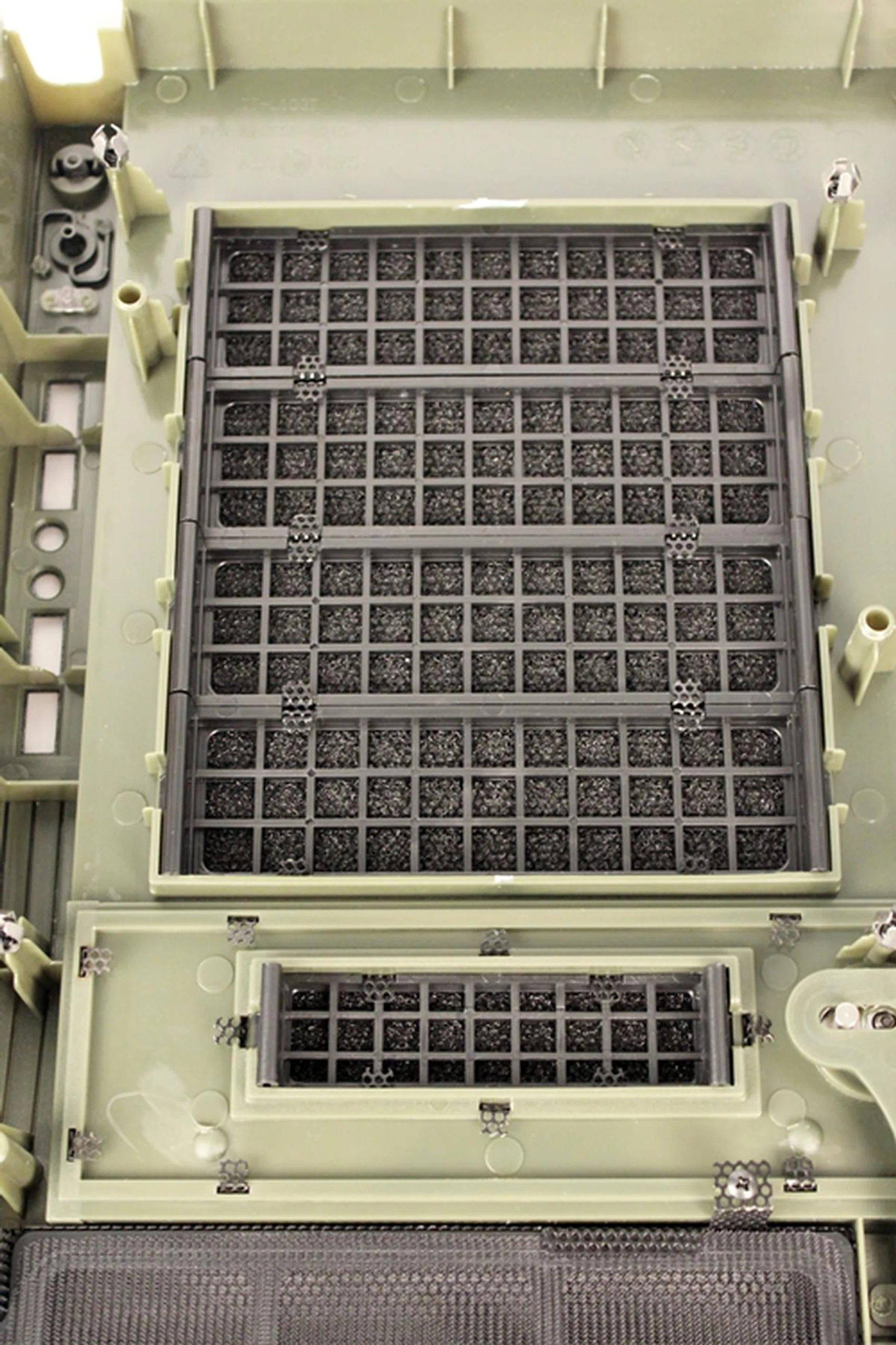 Shown here is the rear of the drive bay covers - they have dust filters behind their front wire meshes.