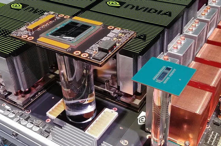 Here's the 2-billion transistor NVSwitch in the flesh (right), compared to the Tesla V100 GPU (left).