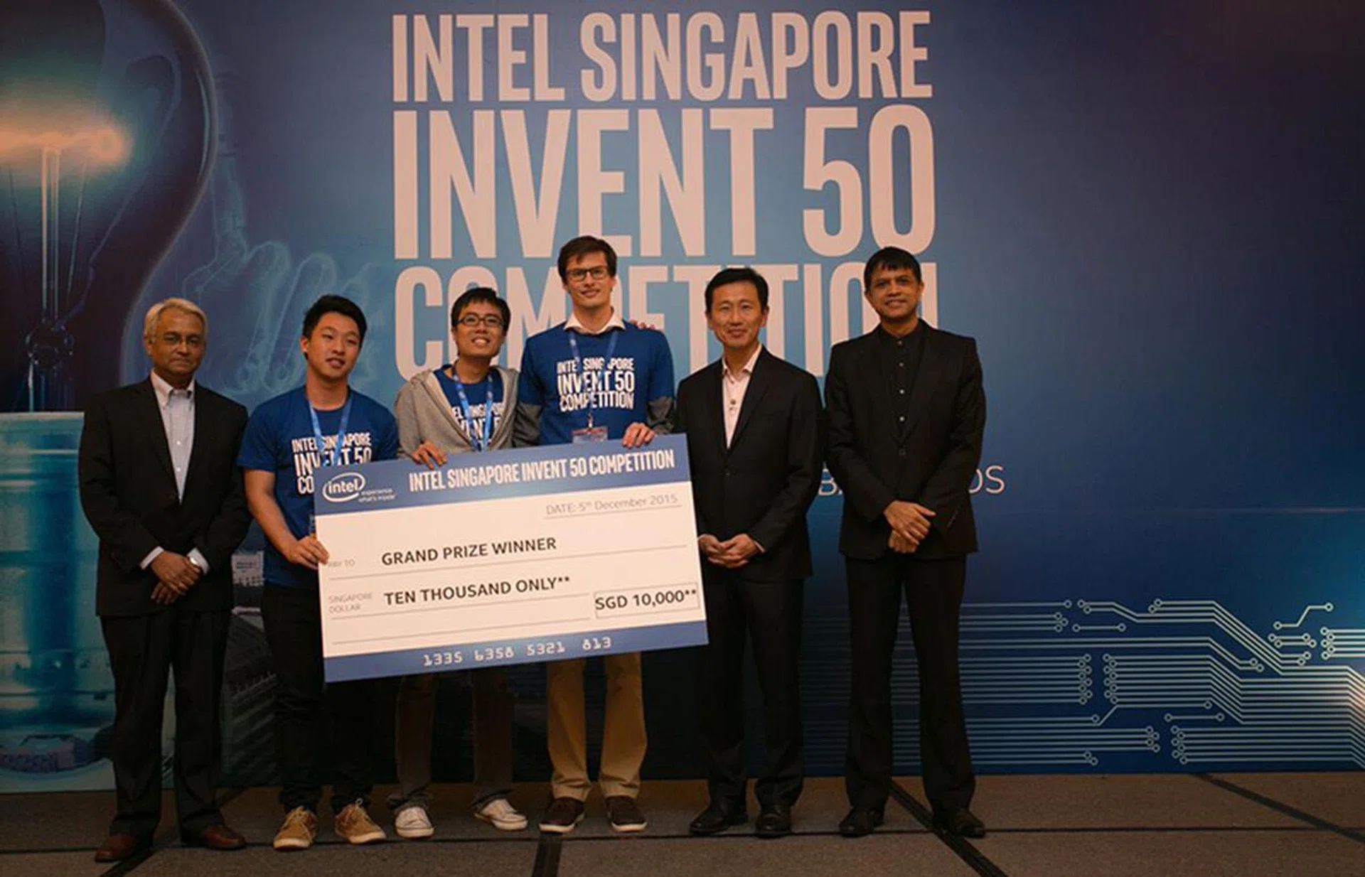 PD Loggers (from left, Daniel Lee, Teo Yew Shen and Val Mikos) on stage with Intel's Dr Anjan Ghosh (left), Acting Minister Ong, and Prakash Mallya, Managing Director of Intel Southeast Asia.