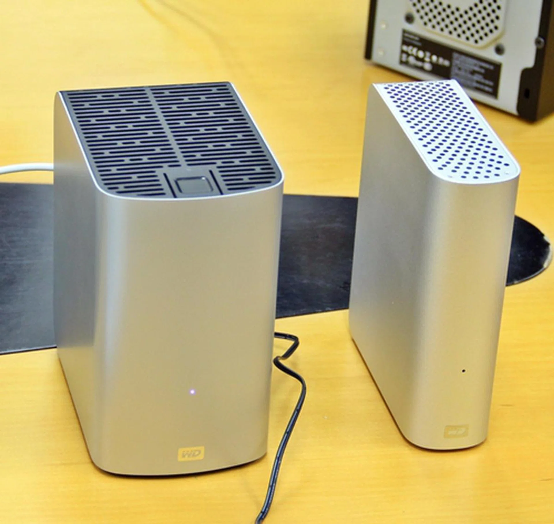 The My Book Studio external drive, on the right, is targeted at Mac OS system users, from its pre-formatted state to its brushed aluminum look. The fatter My Book Duo features an internal RAID 1 drive array with dual Thunderbolt ports for speedy file transfers and daisy-chaining with other Thunderbolt devices.