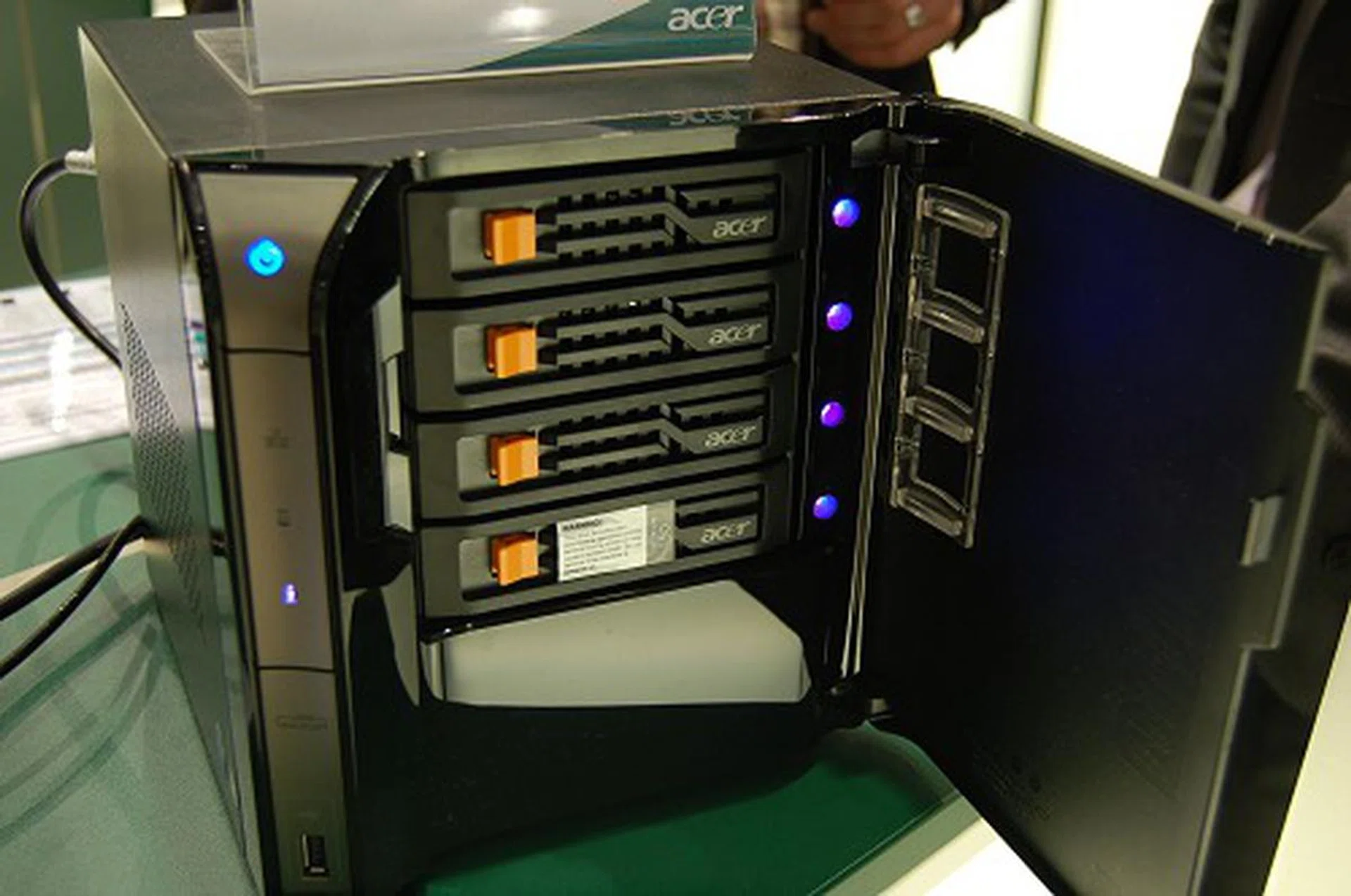  It takes in up to four hard drives, though not hot-swappable. In terms of connectivity and expansion, it has a space PCIe x4 interface inside, five USB 2.0 ports, an eSATA port and one LAN port.  