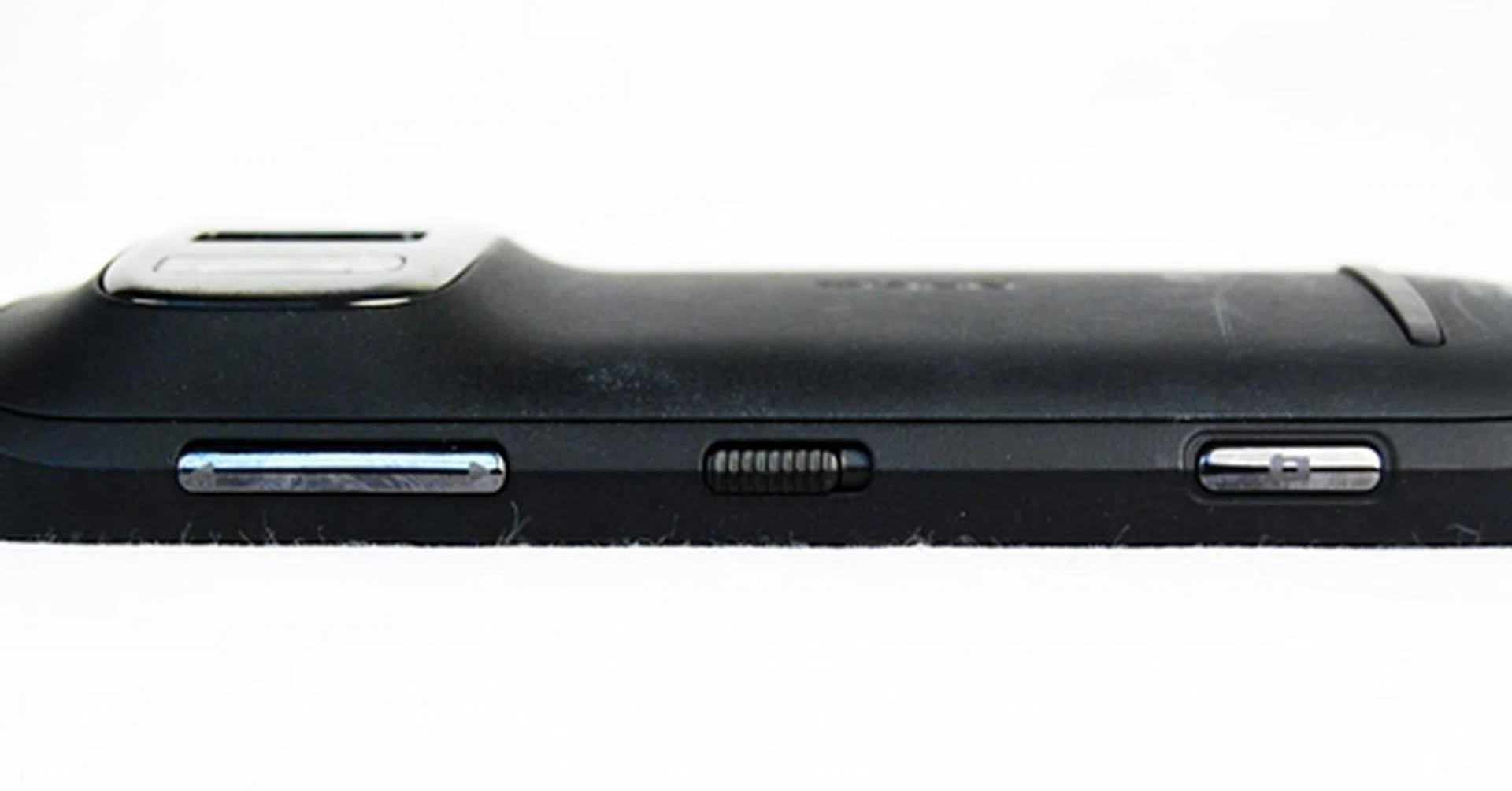 Side view profile (from left to right): Volume rocker, Lock screen toggle, Shutter button