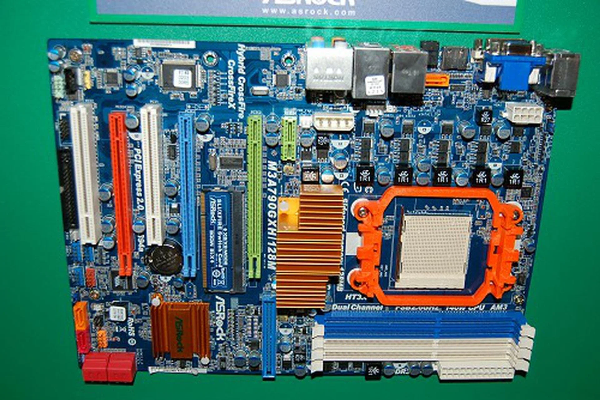 Over on the AMD side of things, they are also equally updated with this M3A790GXH/128M based on the AMD 790GX chipset supporting AM3 processors and DDR3 memory. The board integrates a 128MB SidePort frame buffer memory for the integrated IGP. More interesting though is its triple PCIe graphics card slots - the first two operate at x8 speeds while the last orange slot manages an x4 speed. Otherwise, the board supports all the expected features from the AMD 790GX chipset.  