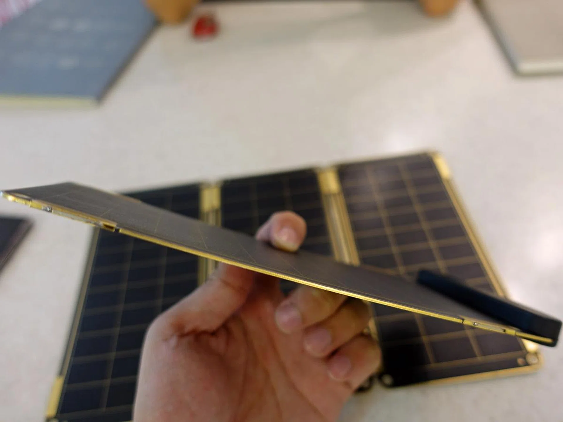 The portable charger panels are deadly-thin. Two of these can recharge an iPhone 6 in 2.5 hours.