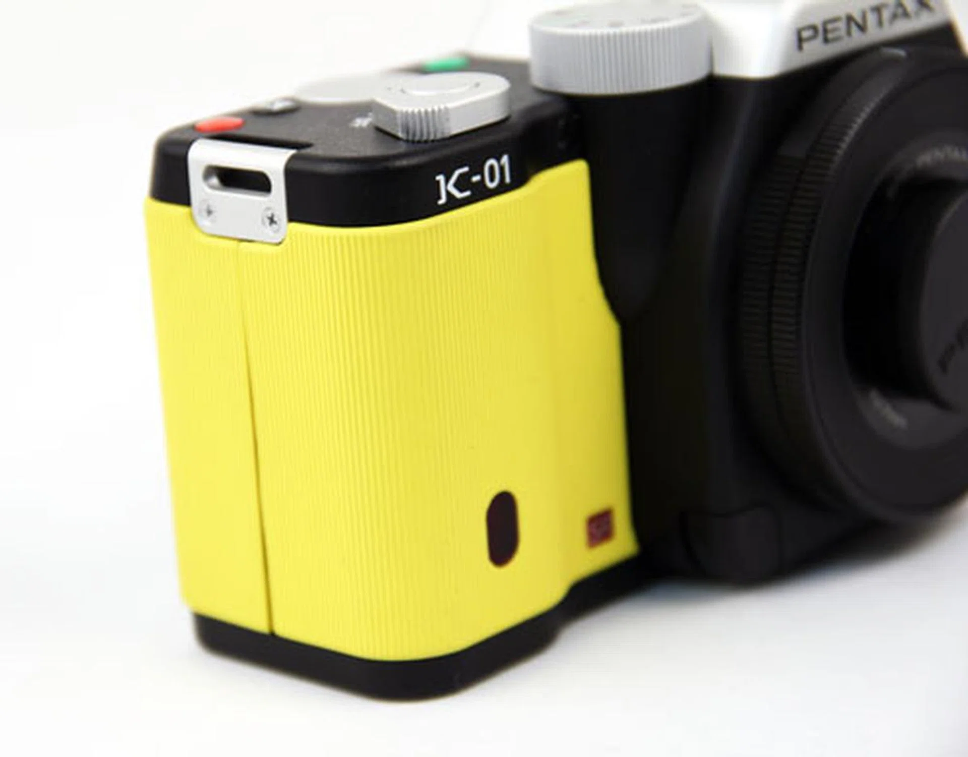 The bright yellow ribbed rubber design gives the K-01 a different look and feel from other cameras.