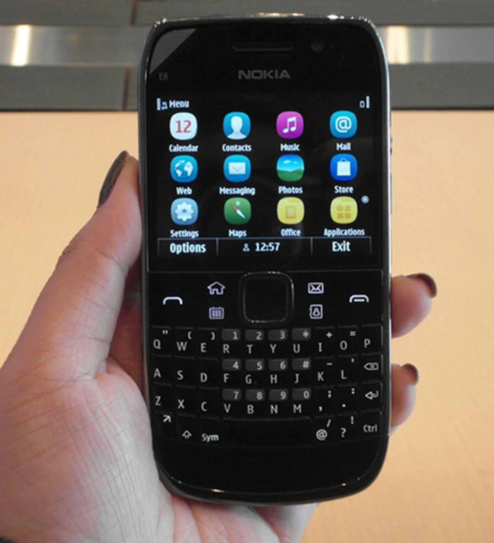 A seen from above, the Nokia E6 comes with a 2.46-inch VGA touchscreen and the trademark E-series 4-row QWERTY physical keyboard. Gearing towards the business-centric users, the E6, like the E7, comes with F-Secure and USB OTG (On-the-Go) features.