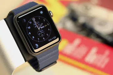 Space gray aluminum Watch Sport with blue Leather Loop and Chronograph watch face.