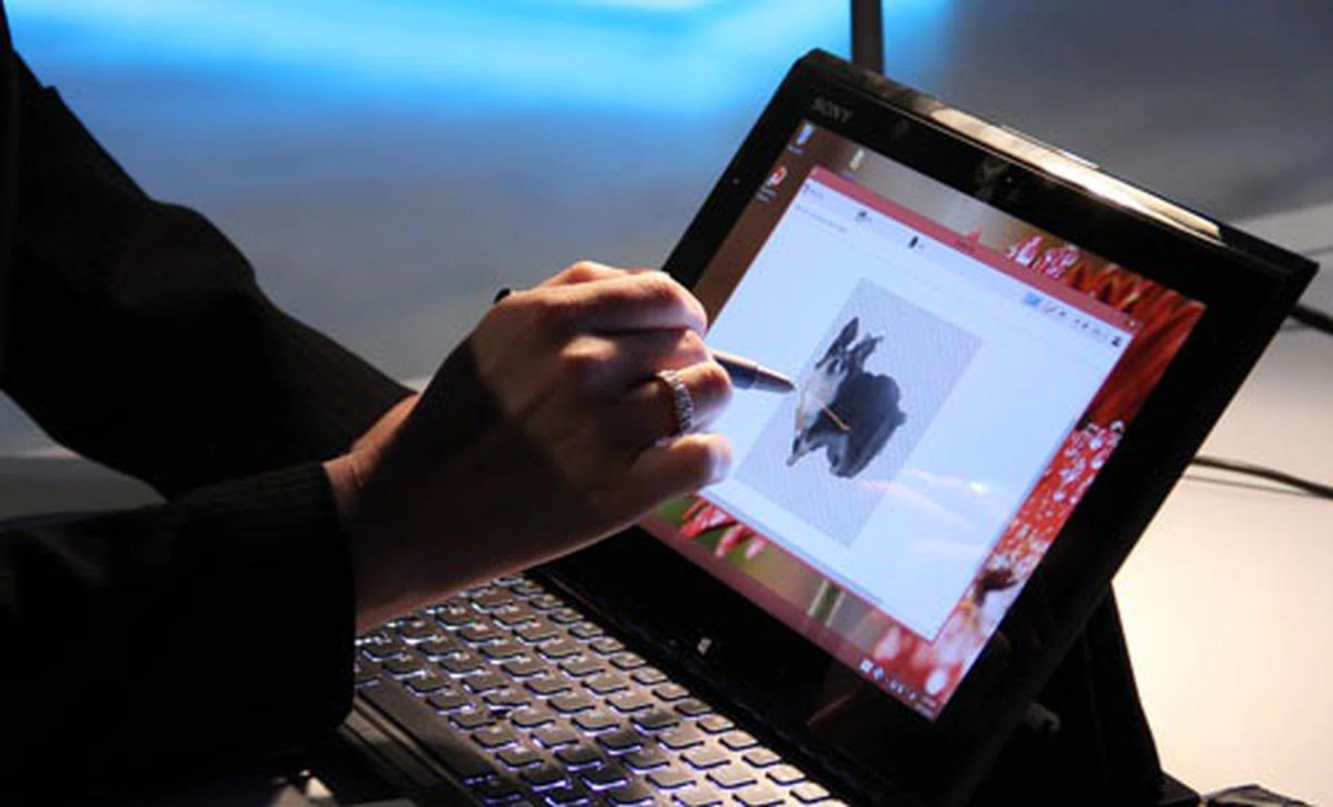 Sony UX Communications Product Manager, Ayumi Hashimoto, using the Digitiser Stylus and Active Clip to easily trace and cut out a picture of her dog.