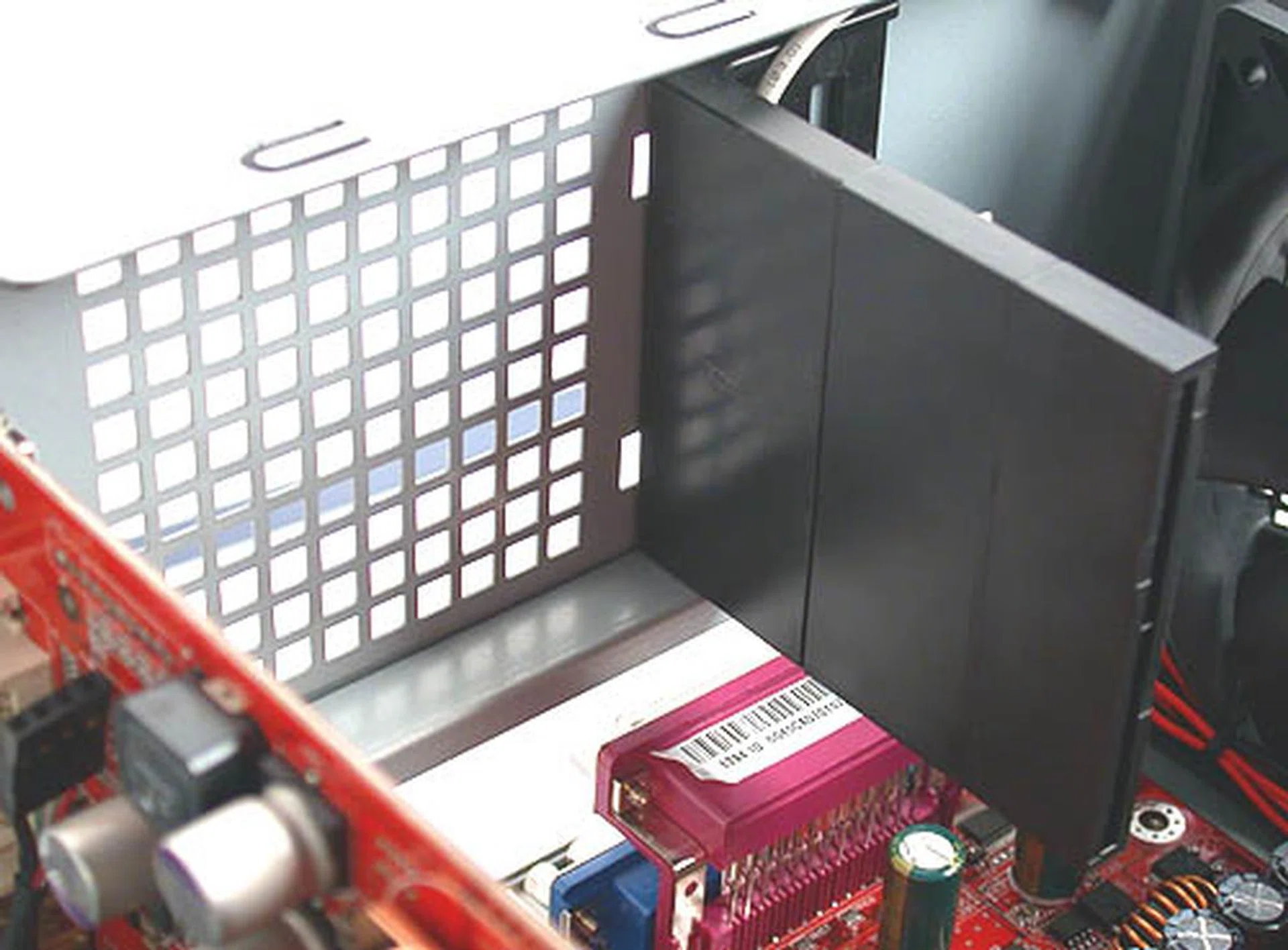 The black plastic protruding is something that Antec calls an CPU air guide. It is supposed to block the air such that it flows over the CPU fan before exiting via the two system fans. The length of this guide can be adjusted by attaching or removing segments (kinda like LEGO bricks) so as to suit your CPU and motherboard.