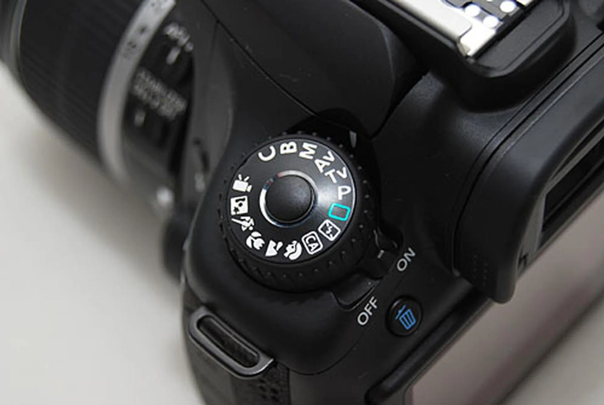 The Mode dial locks down so you won't accidentally switch modes. Press and hold the middle button to unlock it.