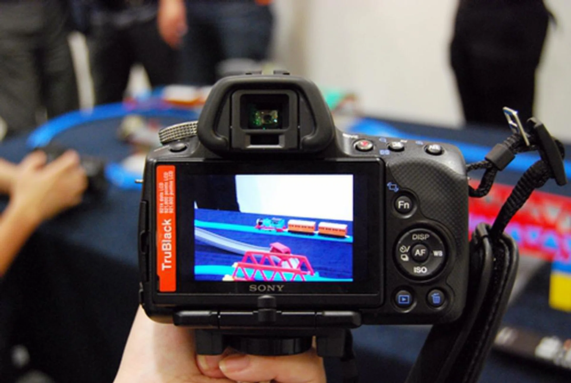 Here, we tried shooting a moving train set with the A33, which shoots up to 7 fps on continuous shooting. The A55 can shoot up to 10 fps.