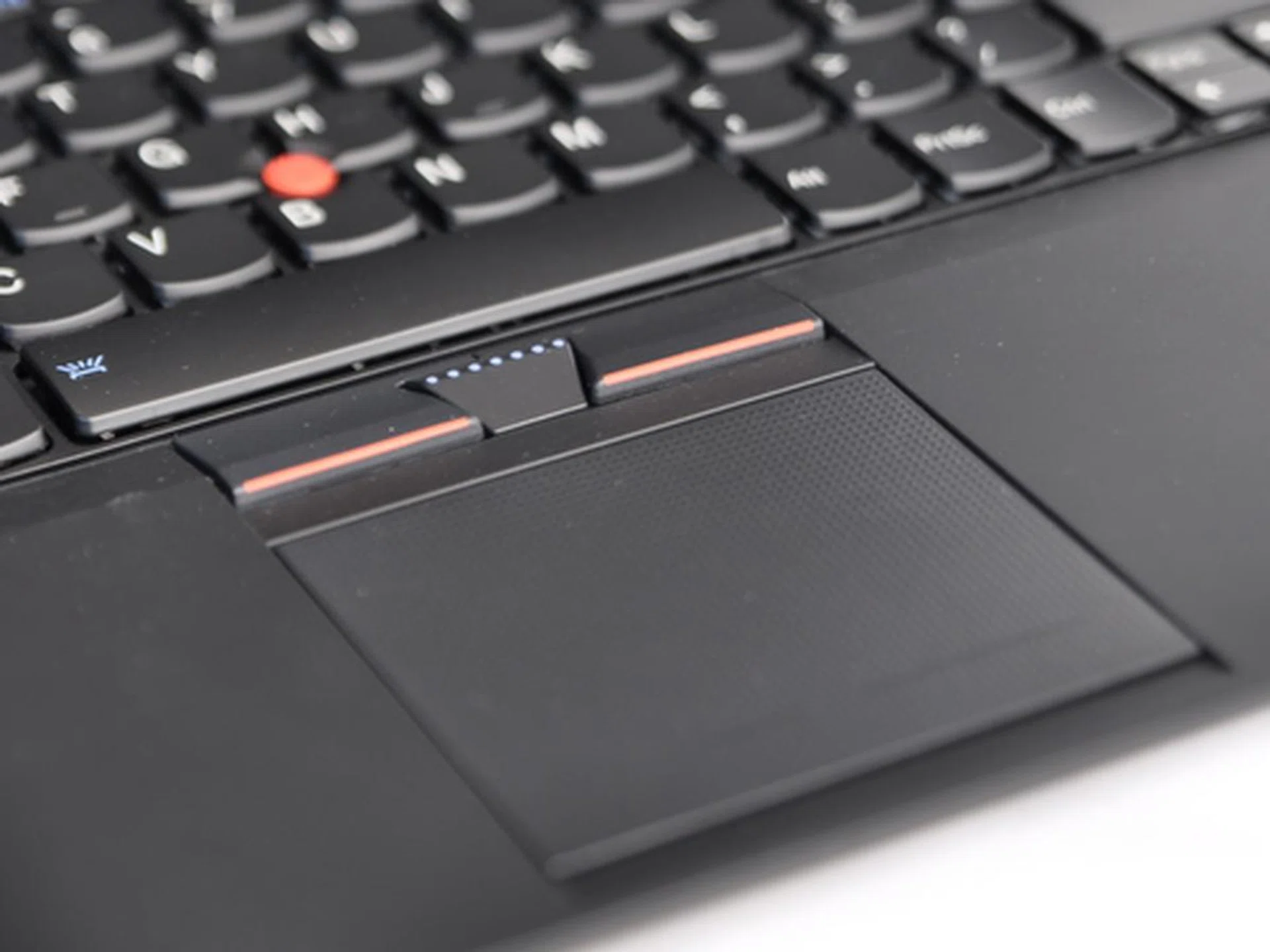 The entire trackpad is a huge button, but it is somewhat hard to click. Tapping on it would suffice as a click.