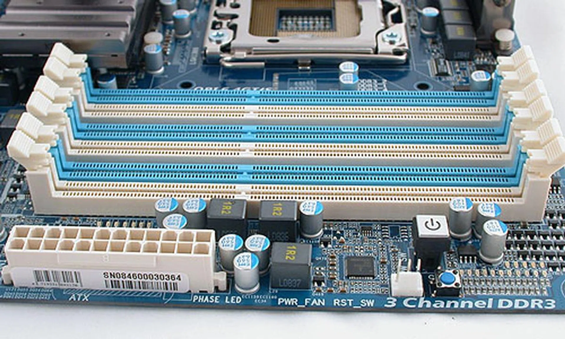 A fairly conventional layout for the memory slots and the ATX power connector. We were however a bit surprised that Gigabyte has shifted the power button here, though the front panel connectors are at their usual spot near the SATA ports.