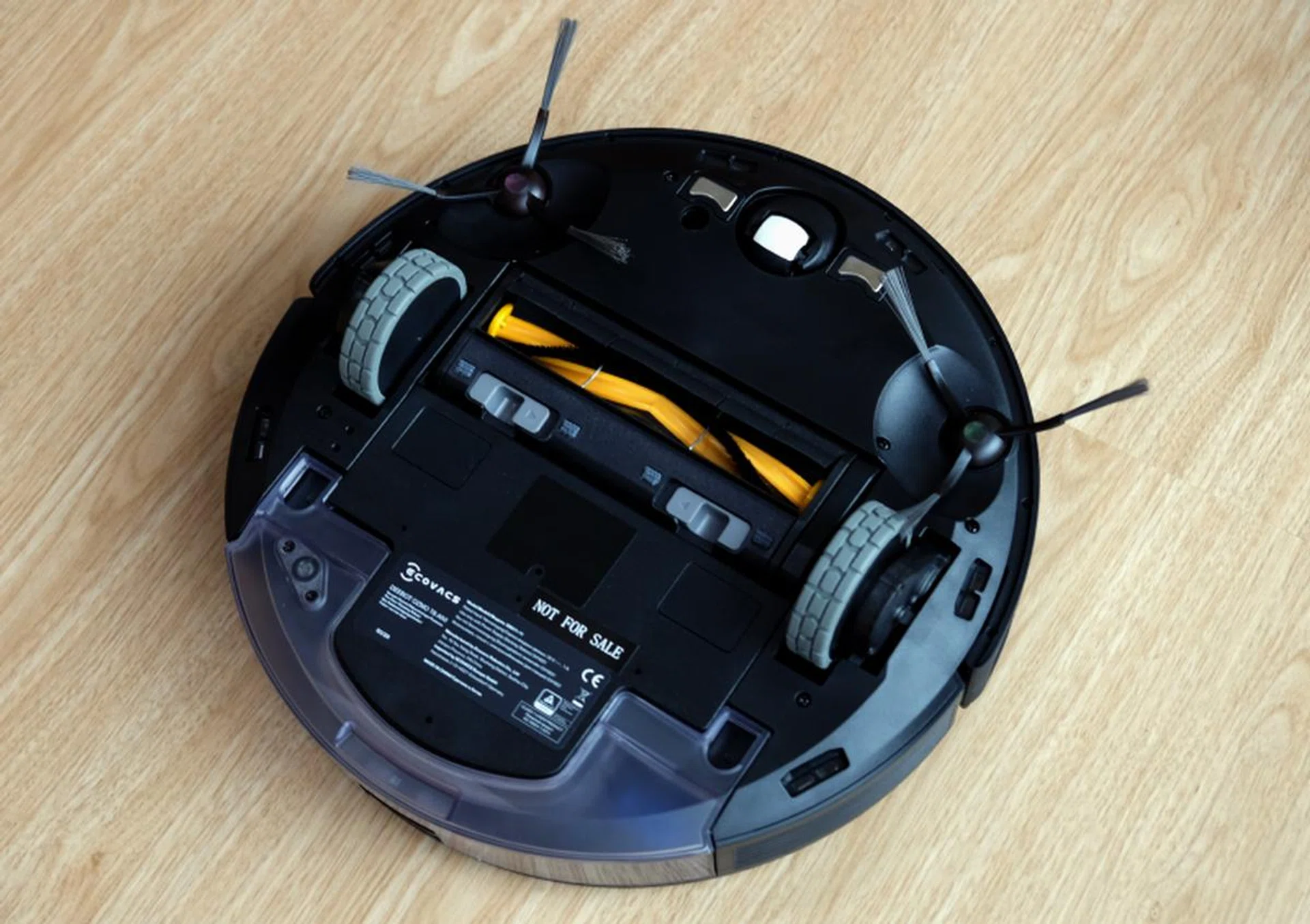 Two rotating sweepers shove debris into the vacuum.