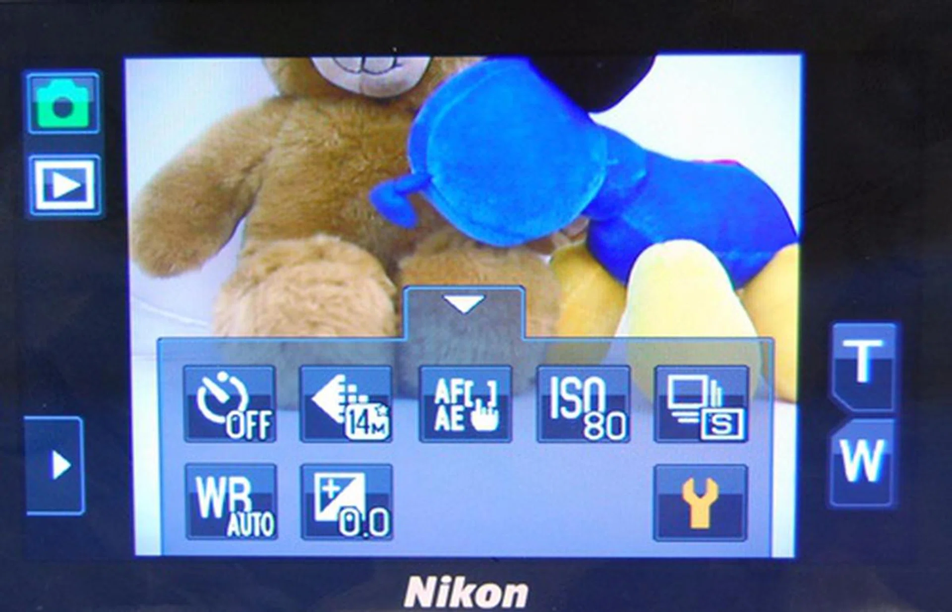 From top left, anti-clockwise: Shooting modes, Playback, tab with Flash and Macro modes (hidden), tab with shooting parameters such as ISO and white balance, and zoom controls (T/W).