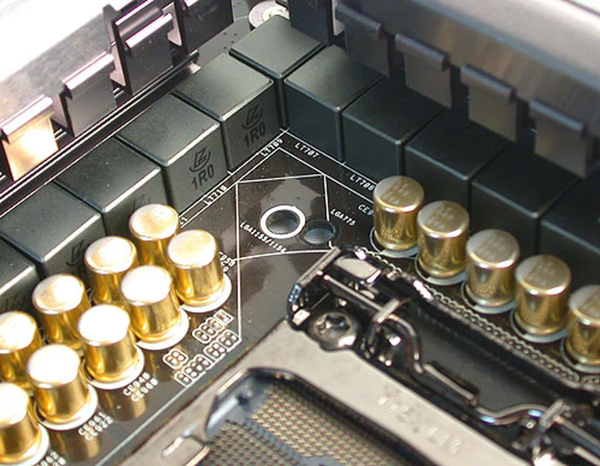 One of ASRock's more innovative moments (albeit not something new) - the multiple mounting holes for the CPU cooler allow for the use of either a newer LGA1155/1156 compatible cooler or an older LGA775 cooler.